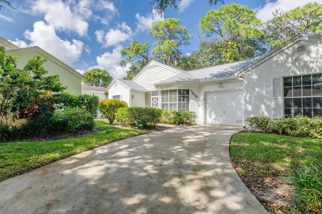 GATED and PET FRIENDLY community in the heart of Boynton Beach. This large 2/2 corner villa has over 1800 sq. ft. with attached 1-car garage and extra parking. The enclosed family/bonus room could easily be used as a 3rd bedroom. The open plan living & dining space has high cathedral vaulted ceilings while the eat-in kitchen has a breakfast nook with a large bay window. The huge master bath has dual sinks, a separate shower enclosure and a sky light. New roof & leaf filter gutter system July 2022. New HVAC and garage door opener 2021 (both smart items). Hot water heater 2020. The community has beautiful landscaping throughout, a clubhouse & heated pool, and lots of green space. Convenient to I95 and Turnpike. Monthly HOA under $300 covers