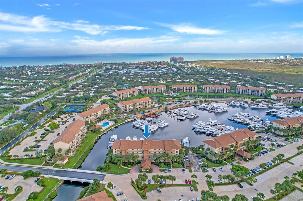 Fabulous marina views from this first floor, 2 bedroom/2 bath desirable eastern exposure condo. Bring your imagination and create the perfect waterfront home located in Marina at the Bluffs. The main bedroom offers floor to ceiling sliders with expansive marina views and en suite walk-in closet. Family room overlooks the private patio and marina. The utility room features full size washer/dryer. The 42 acre property has 4 pools with clubhouse, tennis, bocce and grilling areas along the Intracoastal. Located walking distance to Jupiter's dog friendly beaches, Juno Beach Pier and Bluffs Plaza. NOTE:  This is one of only two buildings in Marina at the Bluffs that allows IMMEDIATE RENTAL after purchase.