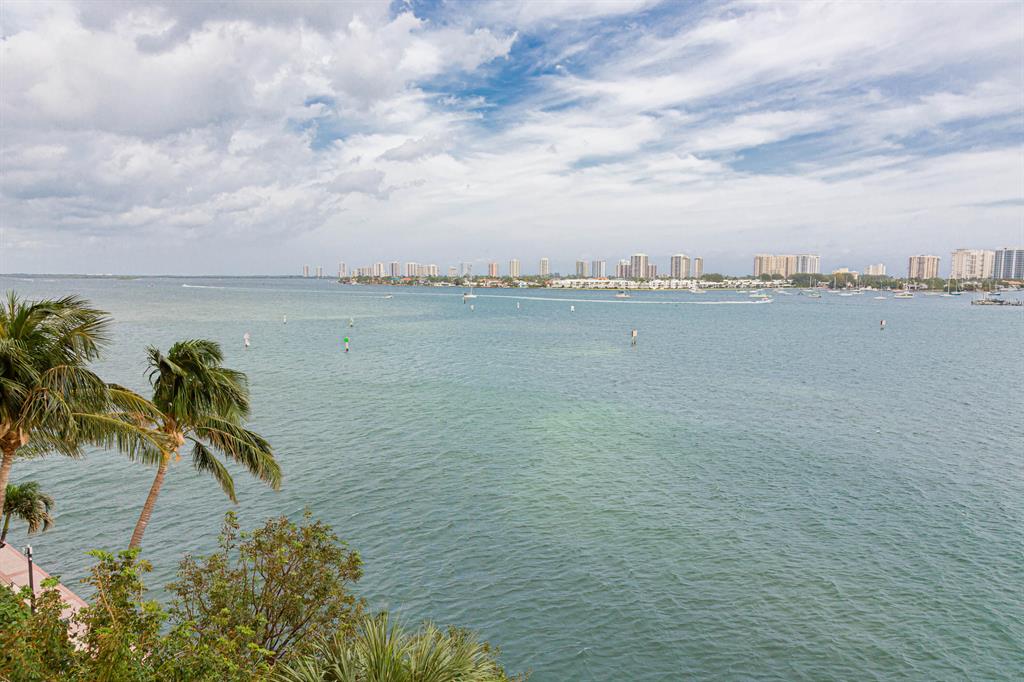MOTIVATED SELLER!! Million-dollar views throughout this residence provide breathtaking sunrises and amazing intracoastal views from this much sought premier 5th floor Ocean Tower unit. Immaculate 2bd 2 1/2 ba home with a large balcony great for entertaining or just sitting outside relaxing & taking in the views day or night. Custom features include: porcelain floors, NO CARPET, spacious kitchen w glass subway tile backsplash, newer SS appliances, granite & marble counters, newer Bosch AC with service certificate, newer LG W/D, window treatments & much more! Unlimited amenities-tennis/pickle-ball, spa with steam & sauna, gym, grills, oversized heated pool, hot tub, social room, billiard room, card room & full service marina! Publix is across the street and the beach is just over the bridge.