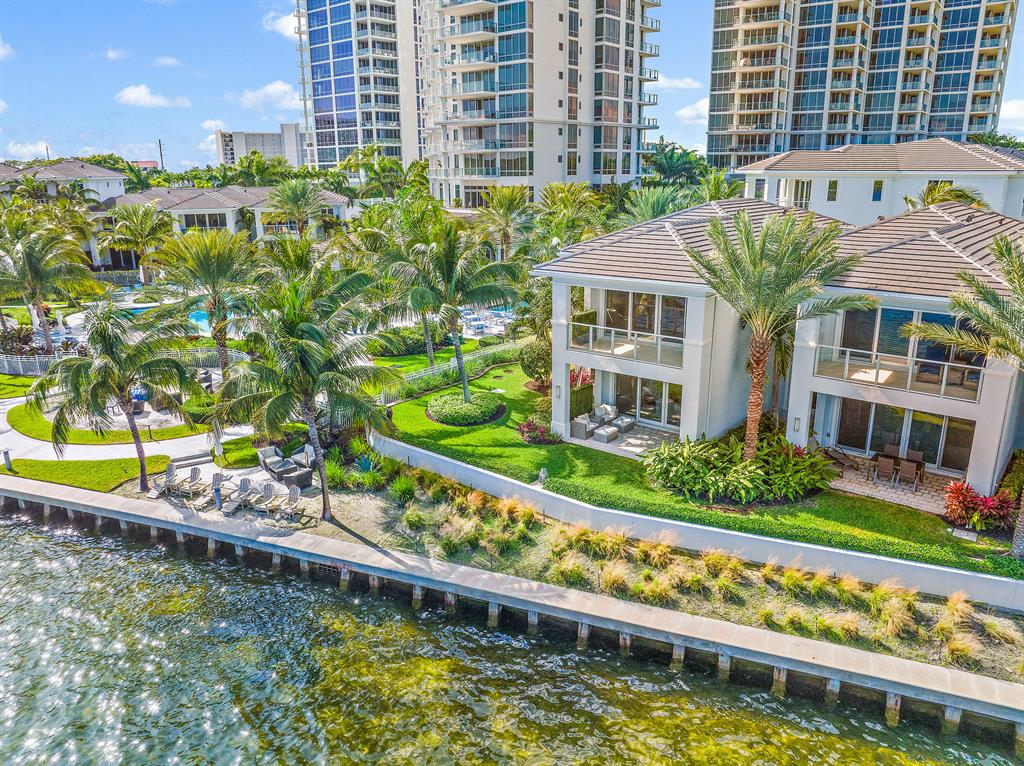 PARADISE AT ITS FINEST. THIS PRISTINE, COASTAL, CONTEMPORARY, NEWLY RENOVATED (2021) WATER CLUB  VILLA HAS UNOBSTRUCTED SOUTHEASTERN, WIDE-WATER INTRACOASTAL VIEWS WITH AN EXTENSIVE SIDE LAWN, UNLIKE ANY OTHER VILLA AT THE WATER CLUB.  * HIGH-END FINISHES/APPLIANCES * CUSTOM CALIFORNIA CLOSETS * NEST/SMART HOME * NO BRIDGES/NO BOAT NOISE * BREATH-TAKING SUNRISE VIEWS!