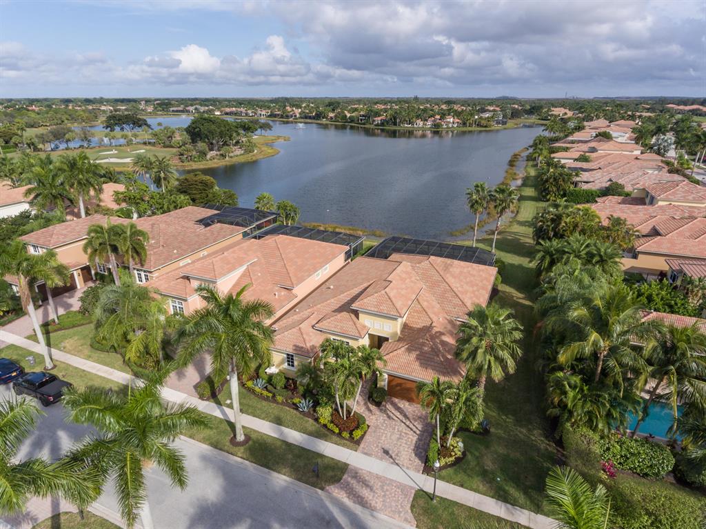Dramatic Water and Golf views across one of the largest lakes in Ibis make this home a dream find! Three bedrooms plus den/office and 3.1 bathrooms and 2.1 garage spaces all on one level. This home has been updated with new plank flooring in all bedrooms. Pool features a new pool heater, new wireless Aqualink system, and all new valves, pump, and filter. Large screened in lanai with incredible water views allowing ample room to relax by the pool with a great view. Large open kitchen with island seating, tons of cabinetry, double ovens, S/S appliances and a gas range make this kitchen a chef's dream. Master suite features two walk-in closets and en suite bathroom with dual sinks, large tub, private water closet and large step-in shower. Accordion shutters on the sides and rear of the home with impact glass on the front. HVACs done in 2018 and 2017. Water heater replaced in 2017. Pool equipment installed late 2021. Plank Flooring and new LED lighting installed late 2022. All sizes and measurements were taken from the property assessor, buyer and agent to confirm measurements. This is a mandatory membership community.