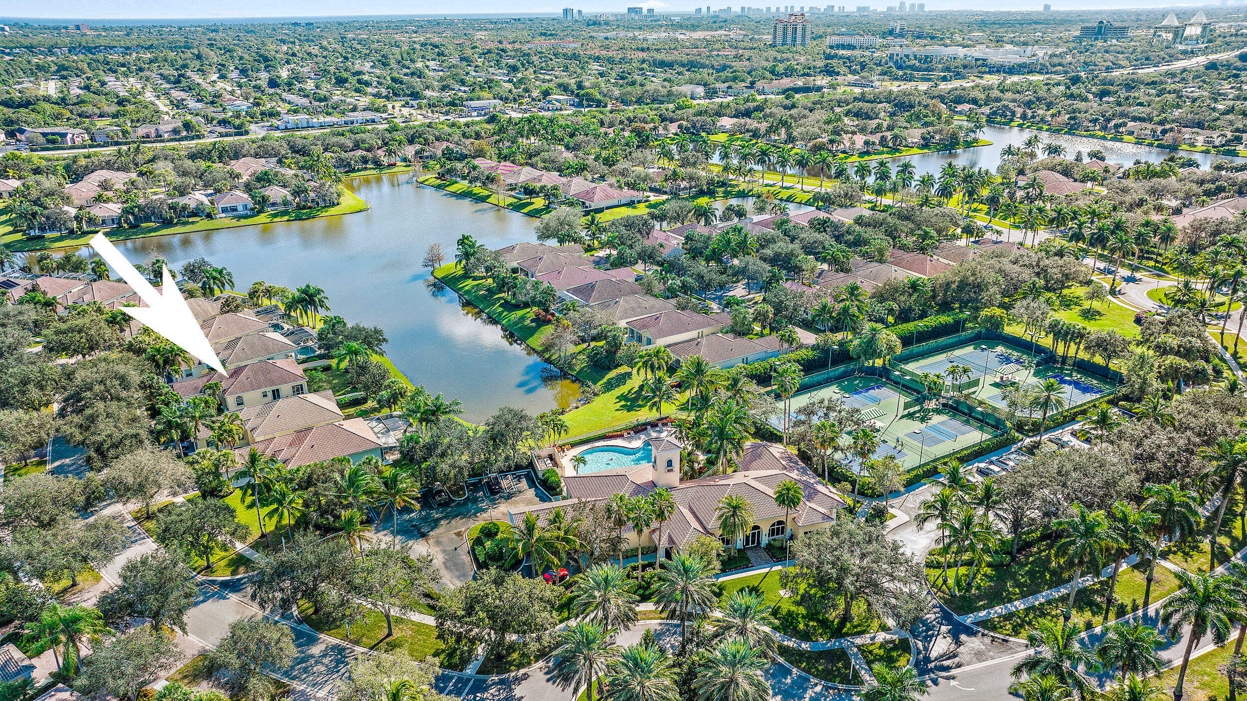 Enjoy south Florida living at its finest in this beautiful lakefront Oakmont model home in the highly desirable community of The Isles in Palm Beach Gardens.  Featuring 3 bedrooms plus a den, 2 bathrooms and a 2 car garage on an oversized lot with additional land (utility easement).  Best building construction with poured concrete walls/slab with full hurricane accordion shutters and cement barrel tile roof.  Home upgrades include Hunter Douglas Blinds, 2018 AC, 2021 hot water heater, 2021 disposal, Kenmore W/D with laundry sink 2017, upgraded ADT alarm system, new microwave 2022, lower custom pull-out storage cabinets, designer pendant lighting and upgraded decorative hardware installed. The home is well located next to the clubhouse, mailroom, community pool, fitness center, tennis courts and pickle ball. The Isles of Palm Beach Gardens is within minutes of some of the area's best beaches, golf courses, restaurants, shopping and offers easy access to the Interstate and Turnpike.