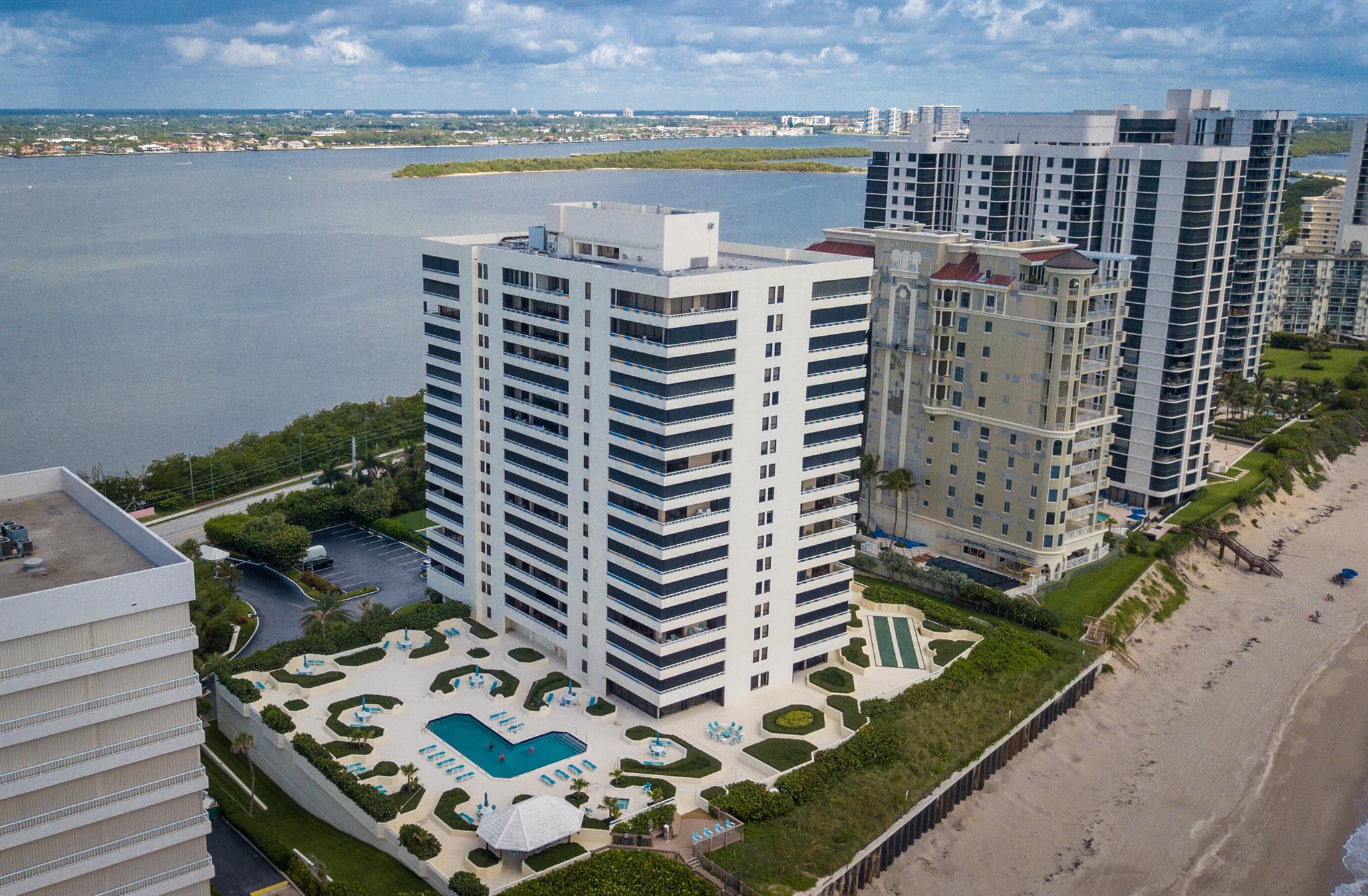 Unobstructed views - SOUTHWEST FACING CORNER unit w/over 1600 lvg sq ft, panoramic views of the ocean & Intracoastal Waterway/ Lagoon w/full wrap around balconies, all spacious main rooms access & have a water view.  Interior large laundry with pantry and additional storage,  ample additional multiple storage areas, one garage parking space plus additional garage parking space access as well as exterior.  All Reaches common areas have been superbly renovated both inside and out.  Ample gathering space large social room w/ocean view complete w/multiple tv's, billiards, pizza oven & more. Gym, mens and ladies locker rooms with sauna.   Tennis, pickleball, one of  the largest pool deck areas on the island,  wraps around the building with pool, spa, shuffle board & more.  More photos coming