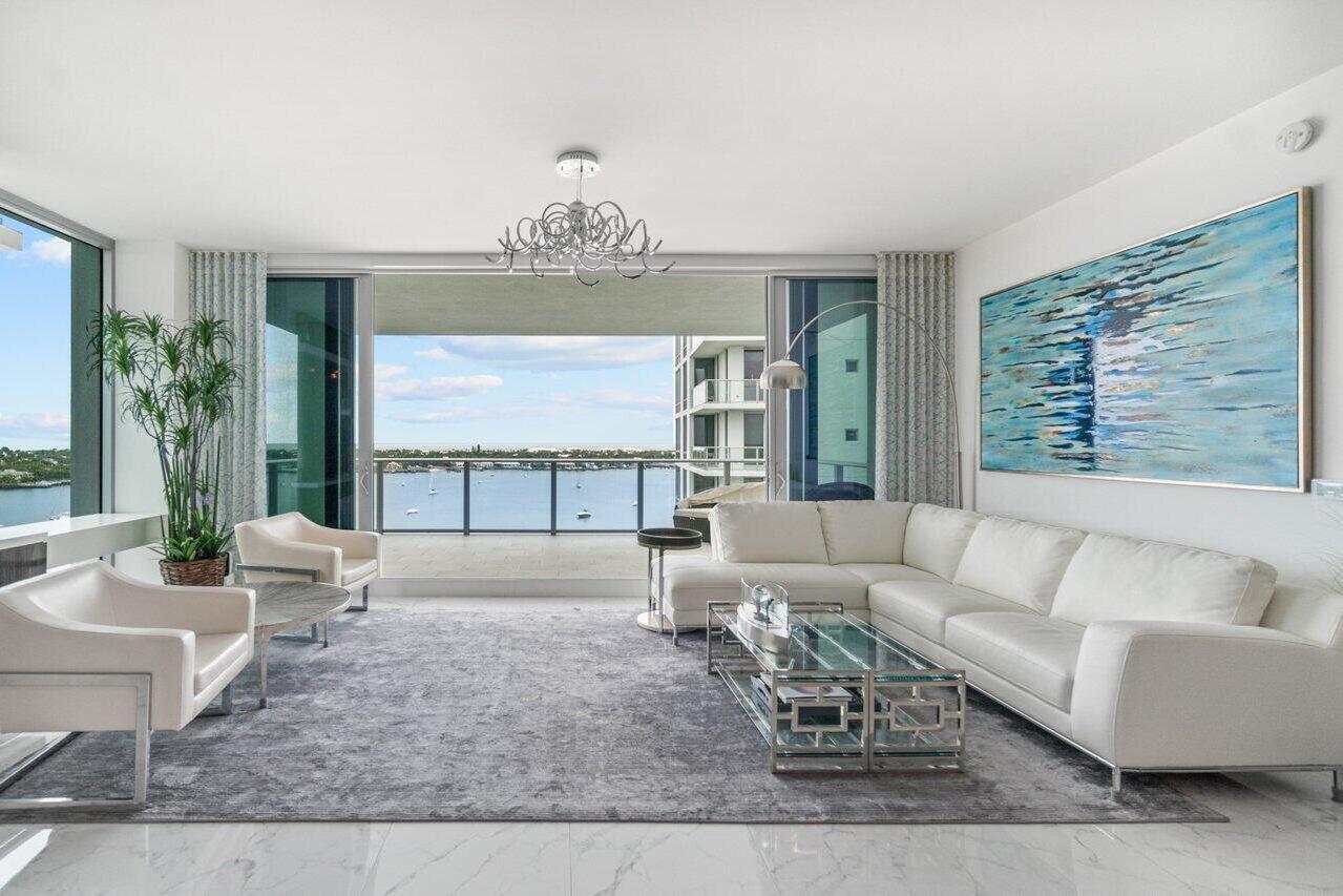 This contemporary 12th floor Water Club condo offers mesmerizing panoramic views of the intracoastal and ocean and a country club lifestyle without the headaches and fees. Located in a highly sought after pet-friendly building, 1 Water Club Way #1204 is the former Builder's Model with upgraded appliances and custom closets. The open floor plan boasts views of the water from every room, floor-to-ceiling windows and doors, and two spacious terraces to enjoy the serene atmosphere and beautiful sunrises and sunsets. Enjoy unmatched, club-like amenities including a private elevator entrance to the spacious foyer, guest suites, three pools, two exercise rooms, pickle ball courts, 24-hour manned gated security.
