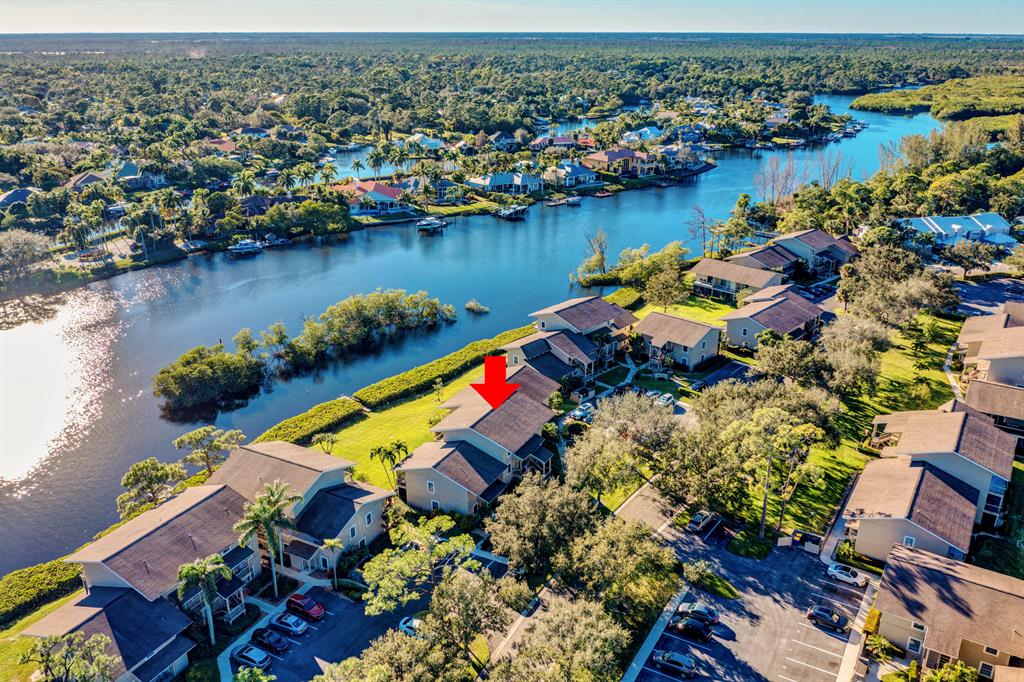 This home is one of the few in the community with a view of the river.Nestled between the Loxahatchee River and Jonathan Dickinson, Florida's largest State Park, this small golf community is a treasure trove of lush open spaces and gorgeous water views.Riverbend is an active community where residents enjoy golf, lighted tennis, pickleball, swimming, boating and social activities. Quarterly dues include membership to the private 18-hole golf course that its designer Tom Fazio himself calls ''the Jewel on the Loxahatchee.''The Waterfront Enjoyment Club has kayaks, paddleboats, paddleboards, rowboat, pedalboat, and other non-motorized watercraft available to its members to use to explore the Loxahatchee River. This home is one of the few in the community with a view of the river.
Nestled between the Loxahatchee River and Jonathan Dickinson, Florida's largest State Park, this small golf community is a treasure trove of lush open spaces and gorgeous water views.
Riverbend is an active community where residents enjoy golf, lighted tennis, pickleball, swimming, boating and social activities. Quarterly dues include membership to the private 18-hole golf course that its designer Tom Fazio himself calls ''the Jewel on the Loxahatchee.''

The Waterfront Enjoyment Club has kayaks, paddleboats, paddleboards, rowboat, pedalboat, and other non-motorized watercraft available to its members to use to explore the Loxahatchee River.  

Some of the home features are a stone wall entrance path, First floor living, Two porches with an excellent view of the river, one in the Bedroom and one in the Living room, Cypress Wood on the Ceiling in the Living Room, Plantation shutters in the Kitchen, Beautiful Wood Sliders for the sliding glass door in the Living Room, storage, New Backsplash tile in the Kitchen, Owners took down mirror wall in dinning room and replaced with Beadboard, took down wallpaper in kitchen, New floors in the bedroom and Wine Refrigerator.  Also have an equity membership in the Waterfront enjoyment club that can be transferred for big savings for new owner if they wish to use the watercrafts.  

Welcome to Riverbend, a community showcasing the perfect blend of tranquility and pristine beauty, with convenient proximity to South Florida's more cosmopolitan offerings.

Riverbend is part of the charming village of Tequesta. With a variety of restaurants, shops, places of worship and unspoiled beaches easily accessible in under 10 minutes, Riverbend is the ideal place to soak up Old Florida ambience and savor life's simple pleasures.

The Riverbend lifestyle is unequaled for the price. Best golf deal in a three county region.  Riverbend may well be one of South Florida's best-kept secrets!

A short drive takes you to the greater Palm Beach area, where shopping and cultural opportunities abound. 
Near scrumptious dining from fancy to casual, first-class entertainment and unique shopping (e.g. Rosemary Square, at the Gardens Mall, Clematis Street, Worth Ave, Downtown Palm Beach Gardens, the Kravis Center, the Maltz Theatre)

More benefits of living here.

Off the beaten path and away from heavy traffic and noise
In Martin County, meaning lower tax rates.
Easy access to most local businesses via lightly traveled side streets.
10 minutes to local beach and parks.
30 minutes to West Palm Beach (PBI) airport.
On the Palm Beach County line for easy access to all the Palm Beaches have to offer.

AMENITIES

SECURITY: gated community, guarded 24 hours, nighttime lighting.
100 acres of beautifully landscaped property.
Adult heated pool.
Children's heated pool.
Clubhouse on the Loxahatchee River with free Wi-Fi.
Lighted Har-Tru tennis courts, Pickleball.
Teaching Golf Pro.
Golf driving range with practice chipping green and sand bunker.
Cable TV and Private in-house TV channel included in maintenance fee.

SOCIAL
Catered dinner parties with music and dancing.
Community room that can be used for personal parties with board approval with kitchen with a small security deposit. 
Out door grill.
Piano.
Library.
Men's and women's weekly golf leagues for all levels of play.
Monthly golf league luncheons.
Monthly golf scrambles.
Several men's or women's golf tournaments including member/guest.
Twice monthly tennis socials-everyone welcome.
Monthly Friday night potluck socials.
Bingo, mahjong, bridge, art club, book club, etc.

FINANCIAL
Equity ownership in private golf course included in condo ownership.
No debt on the association or golf course.
Balanced budget for both the association and golf course.

Show me a community that offers all these perks in this area at this price.  It can't be done.  Welcome to your future home!!!