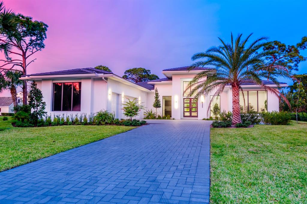 5BR/5.1BA custom estate home on a 1+ acre corner lot, in the highly sought-after luxury gated community of Steeplechase in Palm Beach Gardens. As you enter through the oversized front doors, your eye is drawn through the high open foyer & straight through the wall of 10 foot sliders out to the backyard oasis with resort style pool and outdoor lanai with summer kitchen & grill area. Inside, all 5 bedrooms are en-suite with large closets. A bonus rooms give you flexibility for a home gym, office, art studio, playroom or even a zoom room. The expansive lot provides tons of space & flexibility. No expense spared from high-end 24x48 imported porcelain tile flooring, to a European-designed custom flat panel GOLA cabinetry kitchen. Wolf Induction cook top and double ovens & Sub Zero refrigeration