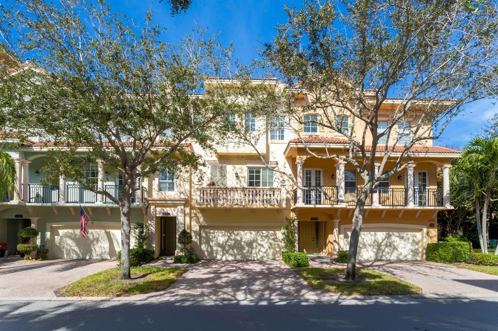 Stunning, open-concept 3-story townhome on the preserve in Harbour Oaks. Safe, gated community located in the center of Palm Beach Gardens with walkability to the gardens mall. The first floor features 2 car garage with added shelving, a central vacuum, and a full guest on-suite bedroom with a full bathroom and private patio with preserve view. Walking up the 2nd floor, you are welcomed by an open concept living room with recessed lighting, crown molding, coffered ceiling, and designer light fixtures with beautiful vinyl flooring throughout. The kitchen features granite countertops, a pantry, and island and a breakfast bar. have 4 bedrooms - the master and two guest bedrooms are on the 3rd floor and the . Master bedrooms suite offers huge walk-in closet w/built-ins and spacious bathroom