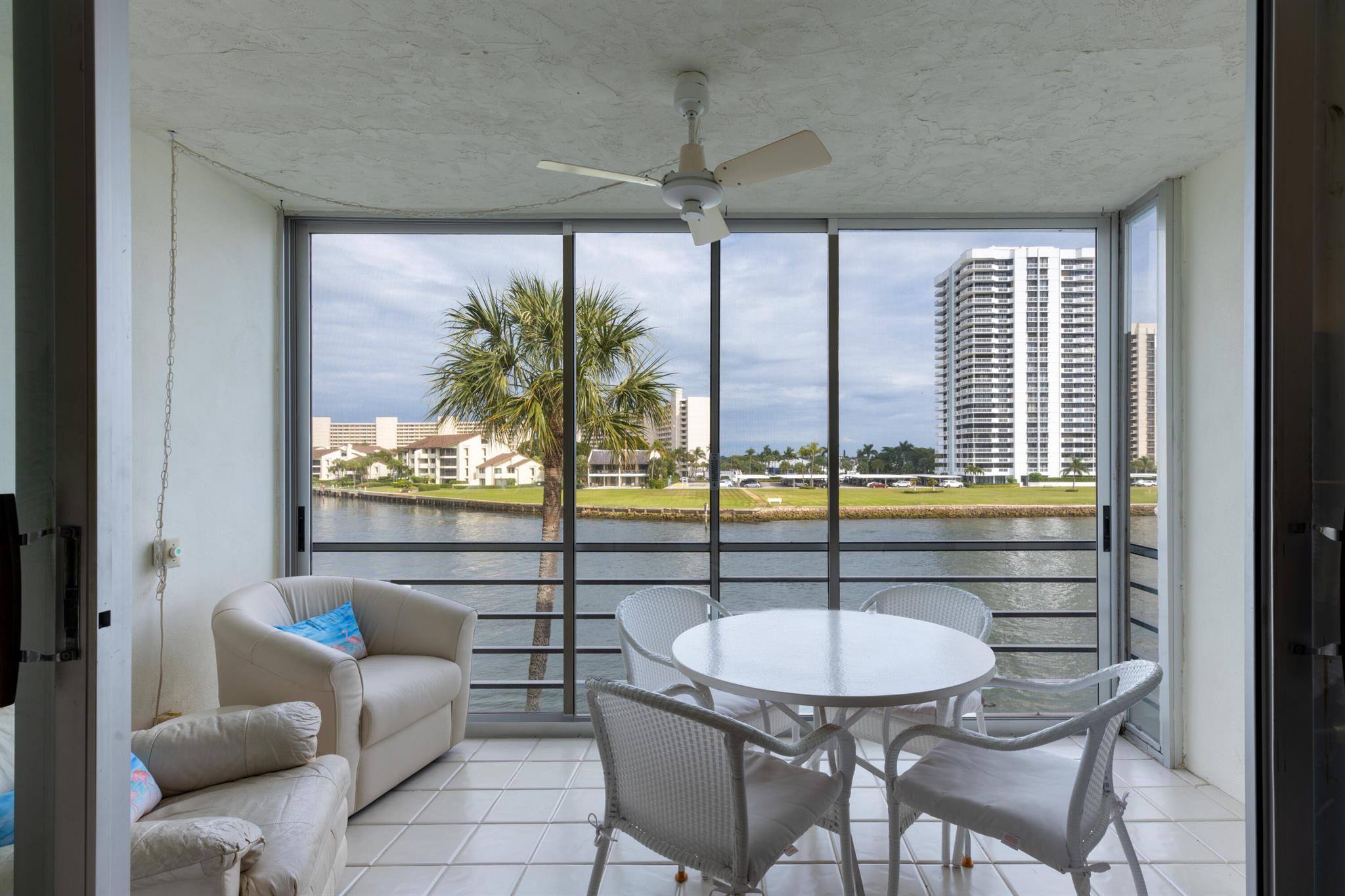 Stunning intracoastal and lake views from this 3rd floor condo in Ports O'Call. Desirable split floor plan features a foyer, an expansive, light filled living space, 2 large bedrooms and 2 full bathrooms. Sit back and enjoy watching boats glide by from your balcony with additional sliders to protect you and your furnishings. Well maintained with new a/c and a new building roof (2022). Assigned covered parking space just steps from the lobby. Fantastic opportunity. Come make this condo your own! Active 55+ community featuring clubhouse, heated pool, gym, private storage closet and day use dock. Direct ocean access, docks for annual rent by waitlist. Walk to the NPB Country Club and Safe Harbor Marina. Close to shopping, restaurants and beaches. 20 minutes to PBI.
