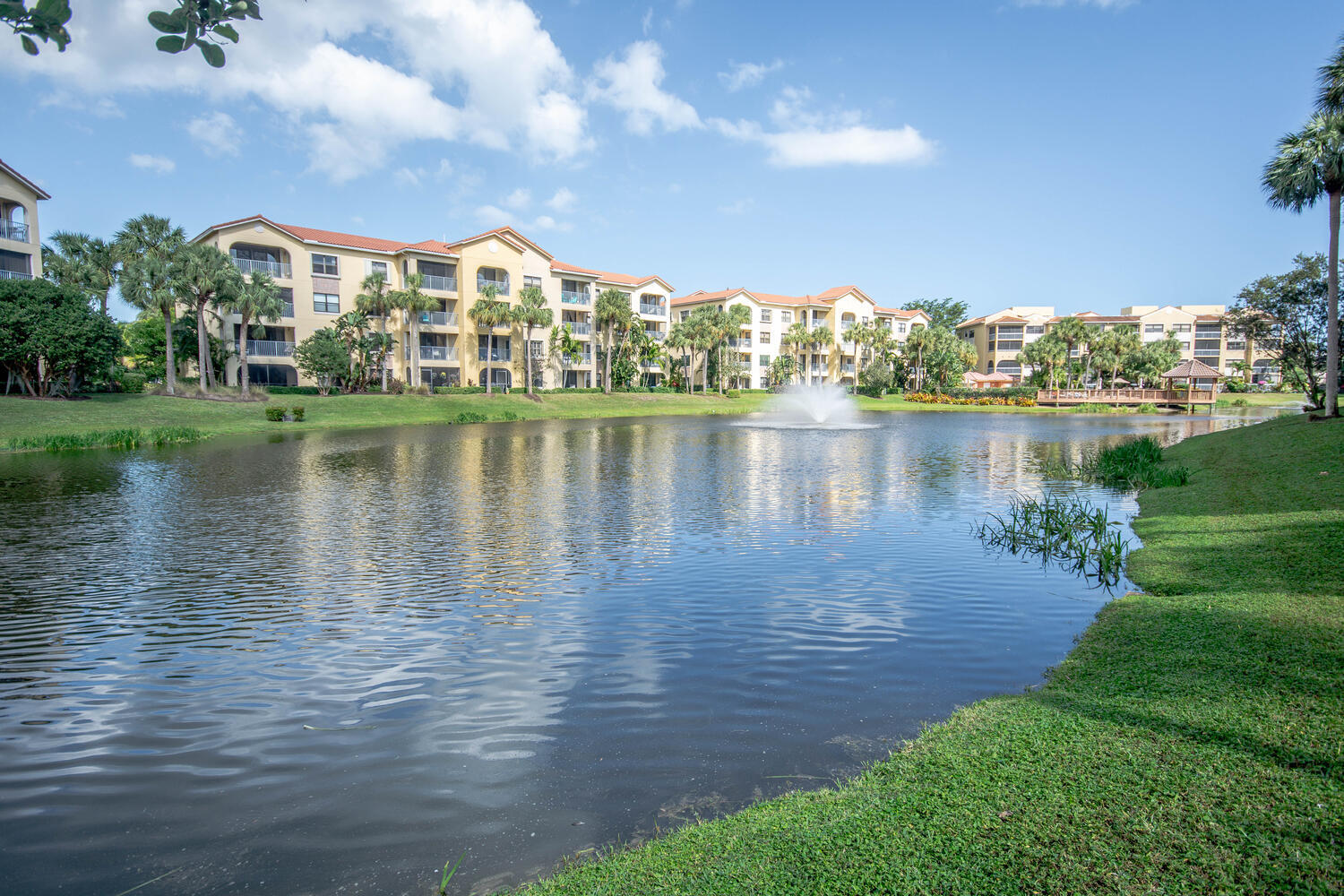 Beautiful lake views from this newly renovated 1st floor unit + 2 parking spaces, 1 covered . Walk to ocean & enjoy everything Juno Beach has to offer. This fully furnished unit features 9 ft ceilings, new luxury laminate floors, freshly painted, new stainless steel appliances, new hot water heater, new AC. Concrete & steel construction, sound insulated & new roof. Just bring your clothes & enjoy the sunshine. Community gated; 2 heated pools, clubhouse, fitness center, jacuzzi, lush landscaping & beautifully maintained throughout. Less than 20 min. from Palm Beach Intl Airport, downtown West Palm Beach & the island of Palm Beach. Uno Lago is within the municipality of Juno Beach. Enjoy a stroll around the famous Pelican Lake, the beaches & small town atmosphere. Vacant & easy to show