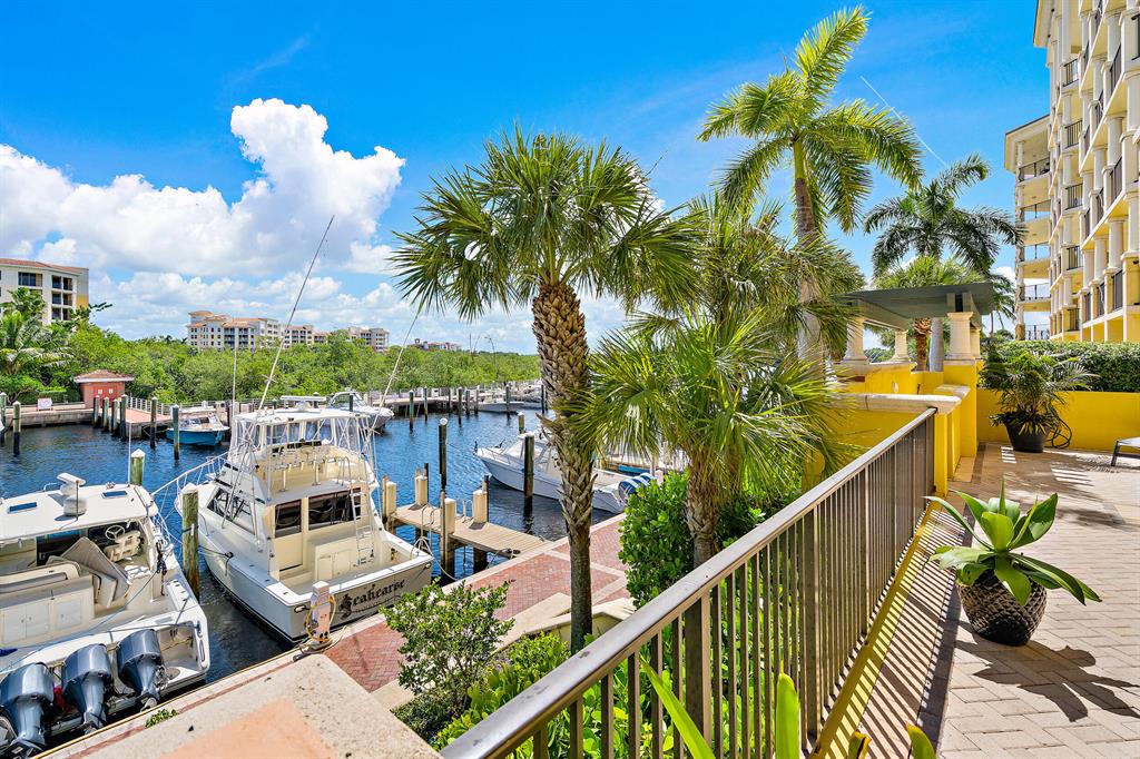 This first floor condo in the prestigious Pointe Building at the Jupiter Yacht Club provides a large living area, two bedrooms, two bathrooms and a den, which could be an occasional bedroom, an office, a gym ... The oversized patio, with its Marina and Intracoastal views, features a private set of steps to the Marina, combining Intracoastal living with the comfort and convenience of condo living. The JYC Marina is a hurricane hole with no fixed bridges to the Jupiter Inlet. Residents of The Pointe Building have access to first class amenities including two under building parking spaces, a manned front desk, a saltwater pool & SPA and a poolside summer kitchen / BBQ. Bicycle & Paddle Board storage and a  stretch of private beach for picnics rounds of the coastal lifestyle. The Jupiter Yacht Club is home to fine restaurants such as the Dive Bar and Cafe Des Artistes. Located in the heart of Jupiter, minutes away from the beautiful Jupiter beach and within walking distance to Harbourside and some of the area's finest restaurants, shopping, entertainment and the most renowned golf courses of South Florida! Miles of Jupiter beach is less than 10 min walk.