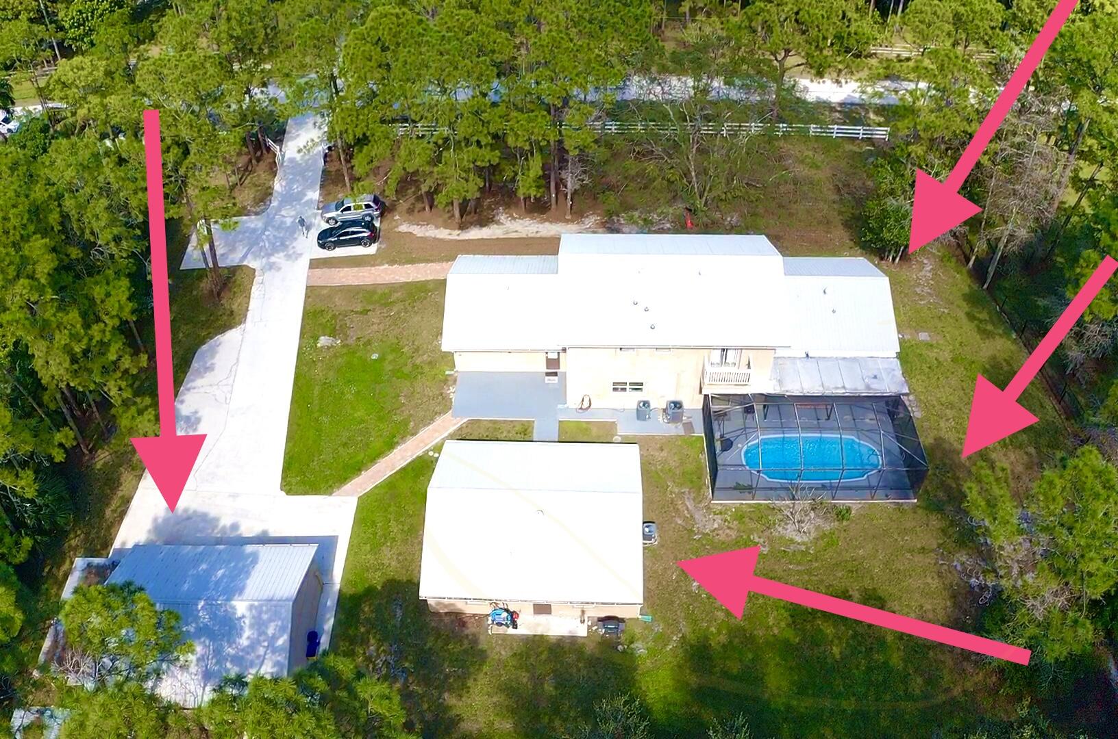 COMPLETE PACKAGE ***MOVE IN READY HOME ***. MASSIVE HOME IN LOXAHATCHEE **. 4863 TOTAL SQ FT ***.  50 yr METAL ROOF ** WELL MAINTAINED **. TOTALLY RENOVATED !!!  **. 1.15 ACRES **. NO HOA ***  7 BEDROOM 4.5 BATH PLUS 3 CAR GARAGE  AND SCREENED POOL HOME  ***. MAIN HOUSE HAS 5 BEDROOM 3.5 BATH  **. AND  2 BEDROOM 1 BATH & LIVING ROOM IN  GUEST SUITE/ IN LAW QUARTERS / INCOME POTENTIAL **.PLUS DETACHED 3 CAR GARAGE WITH CARPORT **  MAIN HOUSE BOASTS 2 MASTER SUITES, LARGE REMODELED  OPEN KITCHEN WITH GRANITE, STAINLESS APPLIANCES, BREAKFAST BAR AND LOTS OF COUNTER SPACE  **.  MASTER SUITE ON 1ST FLOOR   WITH SITTING AREA LARGE BATH  W/ HIS AND HERS SINK , TUB AND SEP SHOWER **. LOTS OF ROOM FOR ENTERTAINING ON FIRST FLOOR  WITH OVERSIZED DEN, LIVING ROOM AND FORMAL DINING **. NO HOA ***. !!! LARGE CONCRETE DRIVEWAY THAT HOLDS UP TO 20 CARS *** NO HOA- BRING THE RV, BOAT, TRAILER AND HORSES * COVERED PATIO - IDEAL FOR FOR CREATING FAMILY MEMORIES/ ENTERTAINING  ** GUEST HOUSE IS ALSO REMODELED * KITCHEN WITH GRANITE STAINLESS APPLIANCE AND HAS 2 BEDROOMS ** AND IS INCOME PRODUCING !!  THIS CAN ALSO BE USED AS A SEPARATE SPACE FOR A HOME BASE BUSINESS  OR MAN CAVE **. IDEAL FOR ANY FAMILY **. MINUTES TO SHOPPING, SCHOOLS, BANKS, LIBRARY AND BEACHES ***. FULLY FENCED ** 2  NEWER AC ** NEW WINDOW TREATMENT STAYS ** 2 INSTANT WATER HEATER- TANKLESS- HW ON DEMAND **. NO HOA****.  2 SEPTIC  SYSTEM. **. SURROUNDED BY ALL NICE HOMES ***.  LOCATION !!!  LOCATION !!!  LOCATION !!!