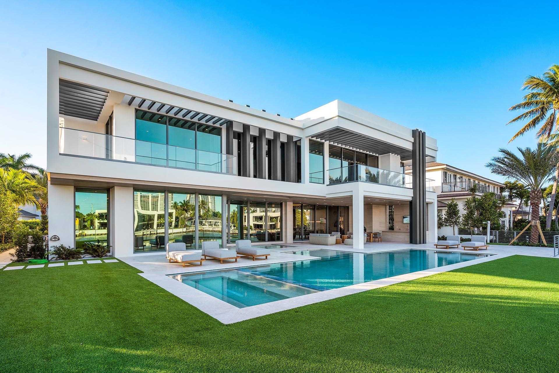 Built by Sarkela Corporation and Randall Stofft architecture, this extraordinary Intracoastal property has over 9,600 sf of living space, 6 bedrooms, 7 full and 2 half bathrooms. The generously sized rooms are finished with the highest quality and natural materials, including DuChateau premium oak hardwood floors, Italian cabinetry finishes, Dornbracht bath fixtures, lighting by Terzani, European marble kitchen and baths, and a marble living room fireplace monolith centerpiece. The home is also equipped with premium appliances and fully integrated Crestron smart-home system. Buyer to pay documentary stamp taxes on the deed and title insurance.