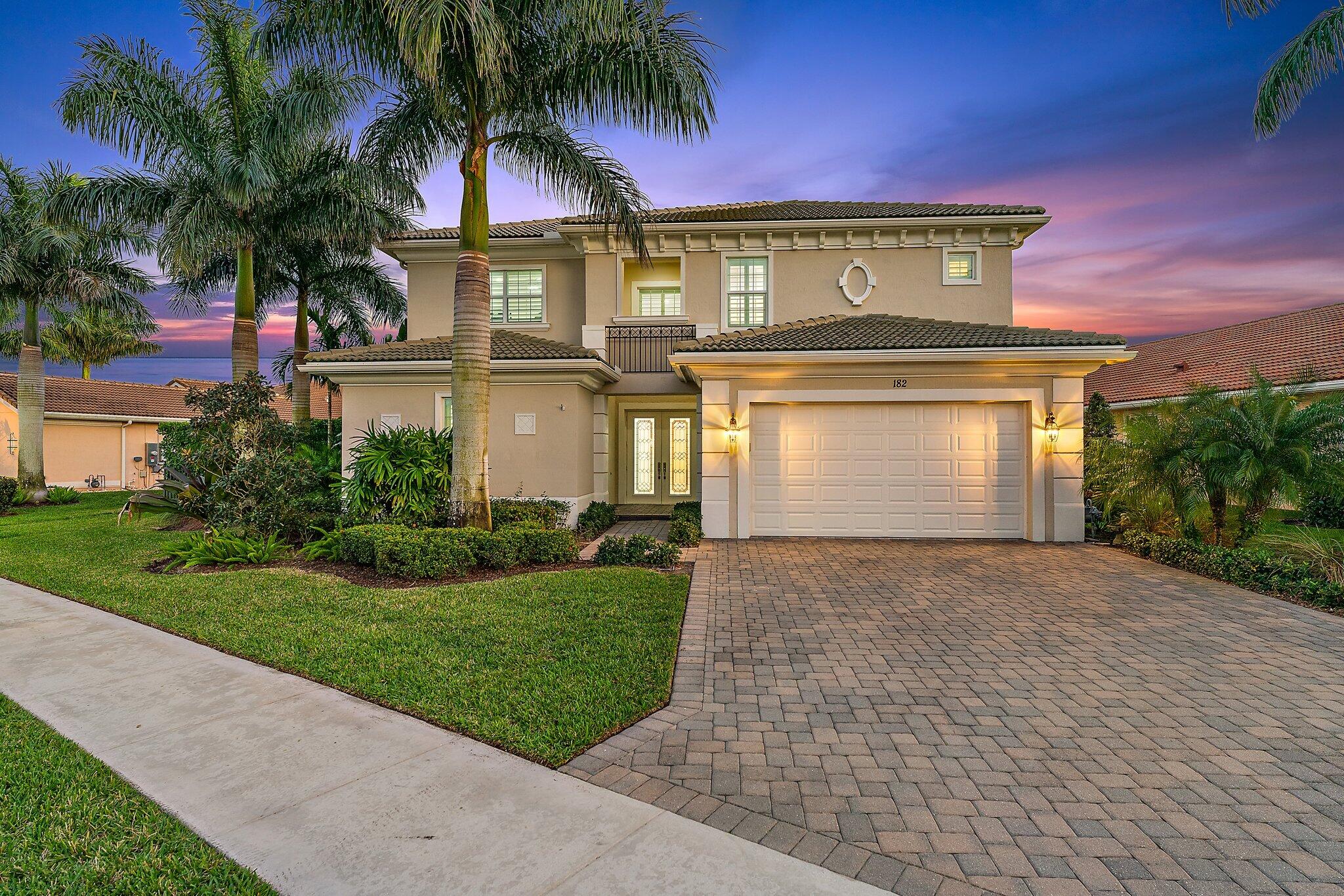 This beautiful modern home sits on the best waterfront lot in Jupiter Country Club! With full privacy, this tropical paradise is an entertainer's dream. A full summer kitchen, expansive patio, large pool with spa and automatic roll down screen enclosures allows you to enjoy this huge backyard year round. Walk through the front doors to an open floor plan layout with many upgrades including plantation shutters, beamed ceiling, crown molding, a massive kitchen island, gas fireplace, impact windows & doors and much more. Located just minutes to shopping, dining, entertainment and beautiful beaches. This home has it all.