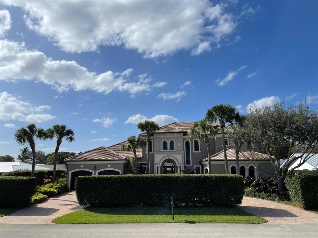 Spectacular Custom Home with only the finest finishes. Marble and hardwood floors. Fabulous kitchen. Enormous lanai with fireplace and summer kitchen. One of a kind estate residence. Quiet cul-de-sac. Backs up to Ballen Isles Country Club. No HOA fees. See expanded Features List in Documents Tab.Parking for 5 on this golf course lot. This house is worth your time to view!
