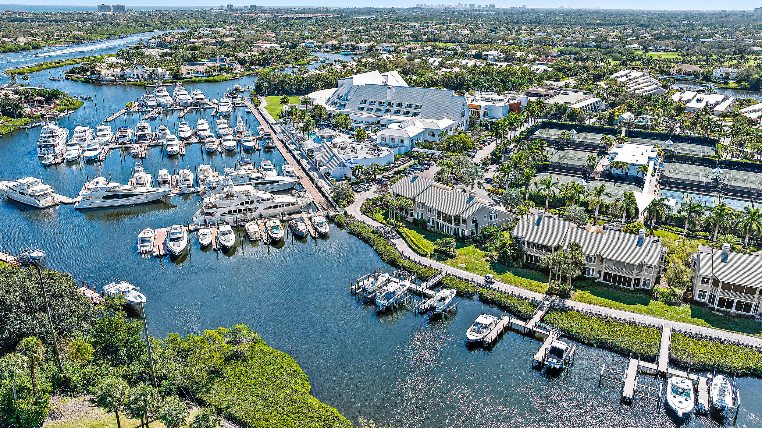 Perfect Location - This Condo is in within close walking distance to The Club, Tennis / Pickleball, Marina and Spa.  Beautiful water, golf and marina views with light and bright rooms, screened in patio, open living concept and best of all, a dock with no fixed bridge! Make this property your own ... priced to sell.