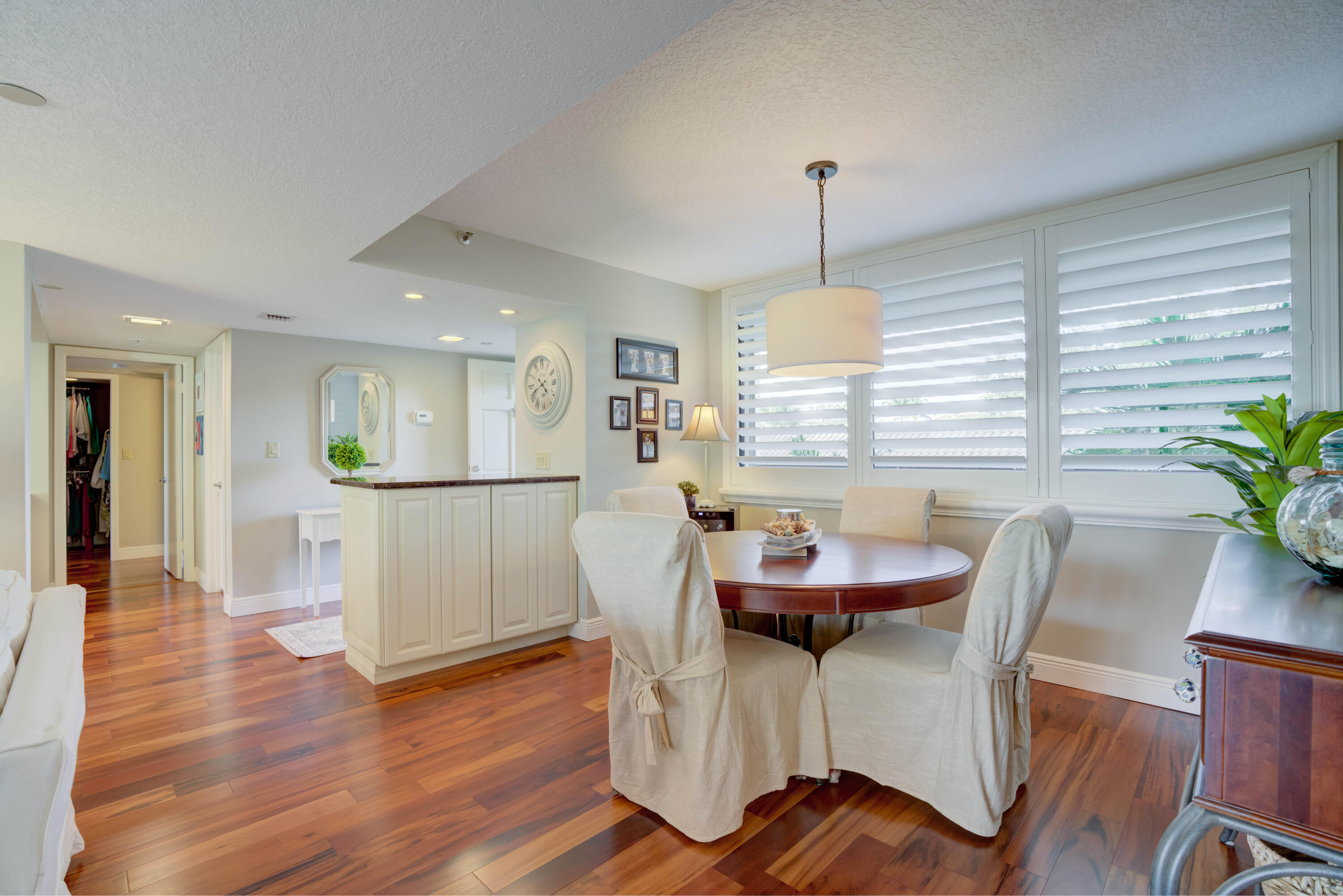 Nestled on the banks of the Intracoastal, this three bedroom condo in Jupiter Harbour is in the Fishermans' Village corridor.  Surrounded by a host of restaurants on the water and the lighthouse, it is but a short distance to the beaches and Dubois Park.   Jupiter Harbour is a prestigious community with both condos and townhouses set on a sprawling campus of walking paths, and greenery everywhere.  Swimming pool, tennis and the ever popular pickleball courts are for your enjoyment.As you enter the condo, your eye is taken straight thru the condo to the waterway.  Once you settle in you can notice the improvements and updates.  Granite counters, stainless steel appliances and oodles of storage present this kitchen as a gathering spot.   See Additional Comments....click below: The snack counter invites guests to sit and engage with whoever might be preparing a meal or pouring drinks.  The chef can peruse the living room and screened balcony from almost any spot in the kitchen.  Second and third bedrooms share a bath on one side of the condo and on the other is the primary bedroom and bath.  The main bedroom offers a view of the intracoastal and has the same Brazilian flooring as the entire condo.  Unbelievable closet space with is open and lighted.  Ensuite bath has tasteful updates with oversize shower, dual sinks, makeup corner, and plenty of storage.  Enough gushing...make an appointment to see this stunning condo.