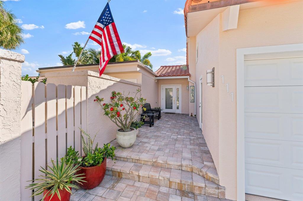 Beautifully remodeled beach home in the gated community of Ocean Walk.  3 bedrooms and 3 1/2 baths.  Impact windows/sliders throughout; roof is 2014 with a 25 year transferable warranty.   New kitchen with high end appliances like the Wolf gas oven, Sub-Zero refrigerator and Asko dishwasher.  Gorgeous wood cabinetry with accent lighting and plenty of storage. New tile flooring throughout with recessed lighting.  The whole house was recently stucco'd and there are new driveway and entry pavers.  The backyard is exquisite with travertine and a refinished heated pool with a beach styled deck.  Landscaping includes synthetic turf for low maintenance. A must see!