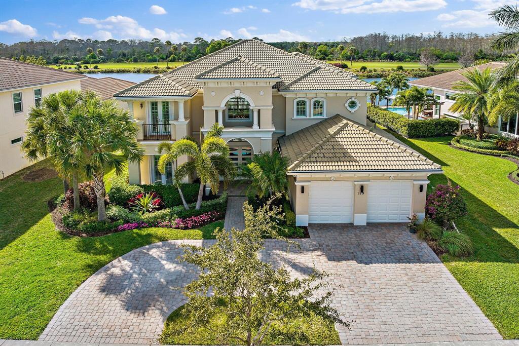 IMPECCABLE, STUNNING waterfront home situated in one of Jupiter's highly sought after Toll Brothers private golf communities, Jupiter Country Club. Have you been searching for a family pool home with high ceilings, mesmerizing lake views and upgrades galore? 179 Sonata Drive will have you SWOONING from the moment you pull into the grand driveway, and see the gorgeous exterior surrounded by upscale, lush landscaping. Enter the home through custom hurricane impact double doors and immediately fall in LOVE with the soaring 20-foot ceilings that lead your eyes through the formal living room and upon the breathtaking lake views. Notice the gorgeous, wood-look porcelain tile floors, crown molding and plantation shutters present throughout. Continue into the living room that maintains the elegance of the home with its picturesque window and gas fireplace, the perfect space for entertaining family or friends. Head to the kitchen to be swept off your feet by the beautiful quartz countertops, upgraded stainless steel Sub Zero refrigerator, gas Wolf range and customized pantry.

With five large bedrooms, a den AND a media room (or sixth bedroom) with floor to ceiling sliding doors, this home has plenty of space for families and guests to spread out and enjoy privacy and comfort. Each of the five bathrooms has updated tiling, Kohler appliances, light fixtures, vanities, as well as custom shower glass doors. Get cozy with a blanket and popcorn in the incredible media room catching up on your favorite movie or show on the big projector screen with surround sound.

Retreat to your expansive, second floor primary suite at the end of a long day, perfect for rest and relaxation. It features two huge walk-in closets and a spacious en suite complete with an oversized bathtub, gorgeous upgraded walk-in shower with floor to ceiling tile, and two large vanities with quartz countertops. Not only is the primary bedroom spacious with sprawling views of the 7th hole, but it also features a private balcony to take in the breathtaking sunsets.

The backyard is a tropical paradise that will make your Sunday afternoon at home feel like a day at a beach resort. Take a dip in your 20x40 foot sparkling salt water pool featuring a sun shelf. Relax after a long day in your custom-built spa as you gaze off into the pink and purple hues from the sunset over the 7th hole. The pool is equipped with a natural gas heater. 

The new backyard addition was finished in 2022 and no expenses were spared. Four 55" TVs to entertain friends and family that can convert to one TV or four individuals equipped with Sonos technology. Custom quartzite island with wine cooler, refrigerator and reverse osmosis ice maker system. EVO hibachi grill and gas grill complete the ultimate "tiki bar" experience. And don't forget about the three hole putting green!

No expenses have been spared when it comes to this home and all of the beautiful upgrades. All of the windows and doors in the home are hurricane impact.

Jupiter Country Club is a desirable community in Jupiter, Florida featuring a beautiful, resort-style clubhouse with two restaurants for members and a Greg Norman designed golf course. This home is equipped with a FULL golf membership! Yes you heard that right! The club is currently on a waitlist, however, the new buyers are grandfathered into this membership if they choose to keep it! The members club includes two sparkling heated pools and spa, a fitness center, fitness classes, basketball court &amp; six Har-Tru tennis courts, plus a playground and walking/biking paths. The community is zoned for Jupiter's "A" rated schools, making it the perfect family neighborhood. Just a short drive away from Jupiter's beautiful beaches, extensive shopping and fine dining options.

Don't miss your opportunity to own this completely upgraded light &amp; bright 5 bedroom + den and media room pool home!