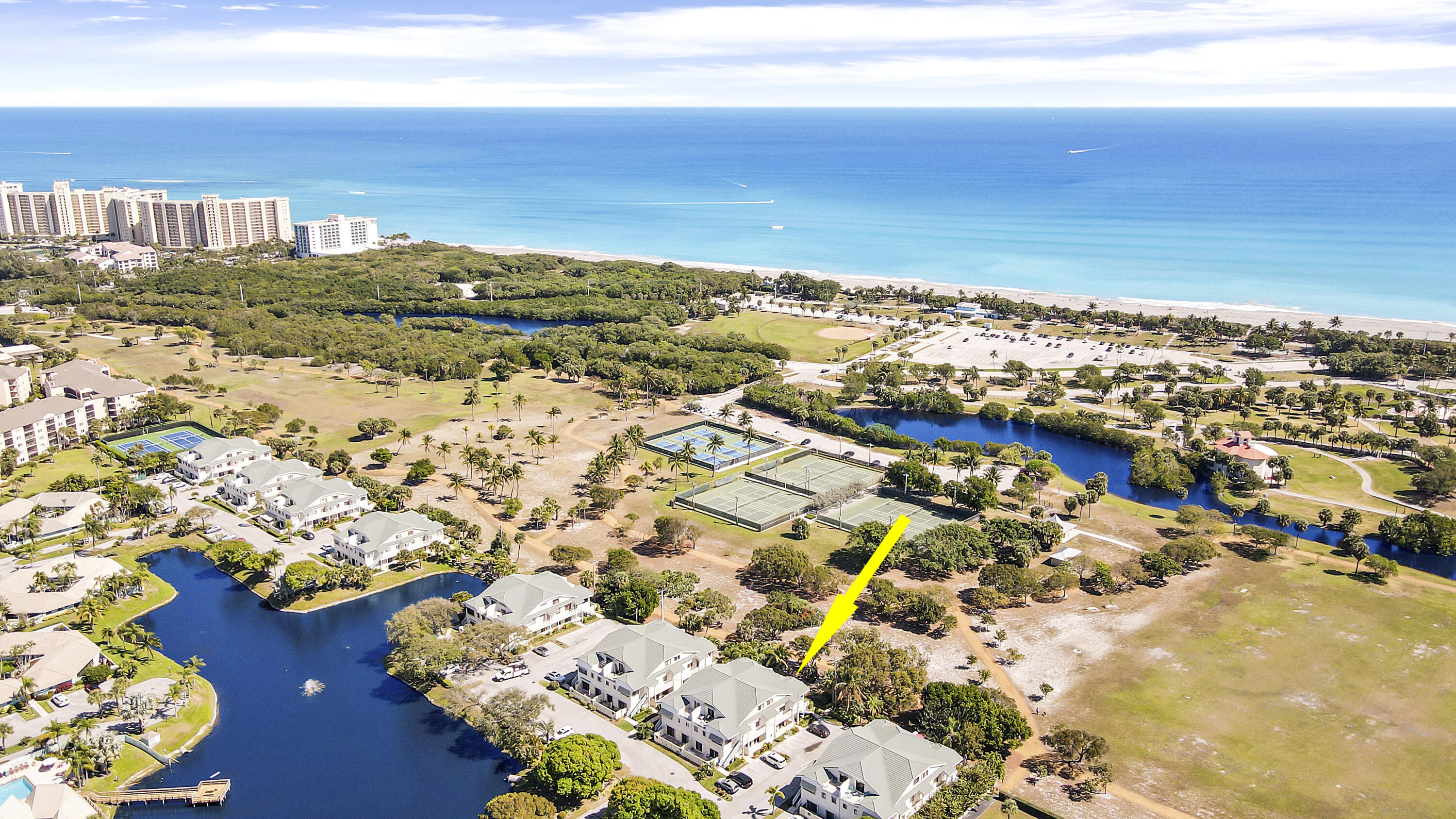 This stunning location faces Carlin Park with the ocean and Love Street in walking distance. Minimal renting restrictions make this condo highly sought after. Additionally, the condo is being sold as a turnkey (minus a few items) making it ready to generate rental income immediately. A new air conditioner with a blue light purifier was installed in 2021 along with a washer & dryer. Paint assessment undecided at this time, will update with more information. The community includes a lake side clubhouse, Tennis/Pickle Ball Courts, a pool, Wall-ball Court, and a Bocce Ball Court. Don't miss this great opportunity in Jupiter!