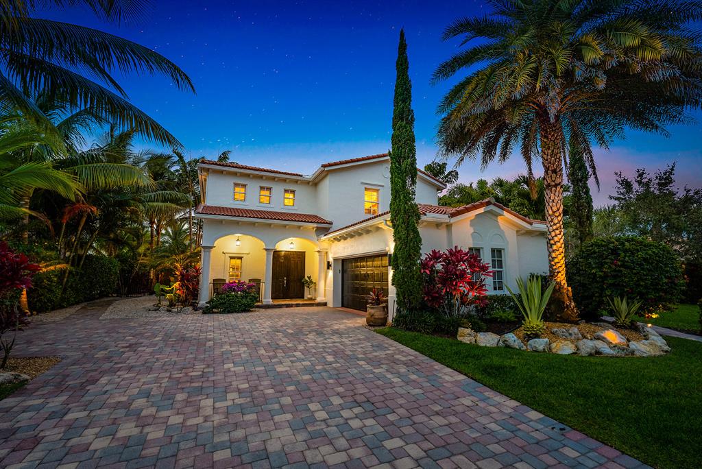 Situated within the gates of Rialto lies this stunningly updated San Marco model with expansive lake views.  This two story solid CBS home has left no stone unturned.  Offering 5 bedrooms, 3 full baths, 2 car garage and just under 3,000 square feet with a back yard you won't want to leave.  The double front doors lead you to soaring volume ceilings, luxury vinyl flooring and a bright spacious living area.  Neutral colors are complimented by plantation shutters and the house is protected by hurricane impact windows and doors throughout.  One guest bedroom and full bath located downstairs with the master and three additional guest suites up. The reimagined chef's kitchen is finished with an oversized eat in island, quartz counters, white soft close cabinetry, gas range with instant hot water, quality stainless appliances including wine fridge, and vented hood.  Top of the line fixtures and finishes are found throughout the home.  Natural color wood flooring through majority of the upstairs excluding the bathroom space.   A luxurious primary suite overlooks long lake views with breathtaking sunsets.  The primary offers dual custom closets and an oversized primary bathroom.  Upstairs laundry room for convenience.  The backyard oasis is designed with attention to detail featuring a large covered lanai and wood decking, travertine marble pool deck surrounding the gorgeous custom pool, lush tropical landscaping with accent lighting and shimmering lake views from every angle.

The HOA takes care of the lawn in front and back as part of dues. Amenities include an amazing clubhouse with fitness center, kids splash park, resort style pool and jacuzzi, numerous playgrounds, basketball, 2 tennis courts, walking/jogging trails and much more. The Rialto social committee is always busy planning events for the residents to come together for people of all ages.  Jupiter Community Park is right across the street and is home to many sports for kids and adults. Rialto is centrally located in Jupiter close to beaches, restaurants, and shopping.  Only a short drive to Palm Beach International Airport and easy highway access with I-95 and the Turnpike only minutes away.