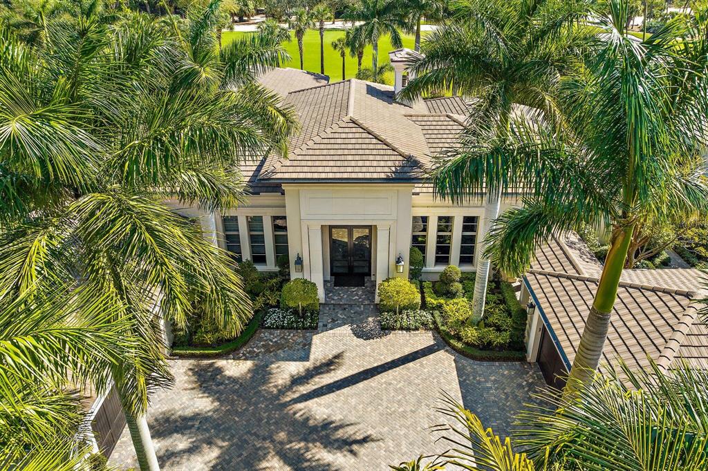 This Stunning expanded Bentley Model home is situated on a private 1/2 acre lot in the sought after Grand Estate section of Old Palm Golf Club. Transitional architecture designed by award winning Affiniti Architects and built by Courchene Development. As you enter through the 10' hurricane rated Mahogany French doors, you are taken back by the beautiful panoramic views of a lovely custom water fountain, swimming pool and the 17th Green of the pristine, Raymond Floyd designed golf course. The bright open floor plan flows superbly into the spacious family room and gourmet kitchen w/Irpinia cabinets and top of the line Thermador professional appliances. The comfortable library offers custom built-in cabinets and sliding doors for privacy and the generous office has impressive lacquered built in cabinets and access to the elegant landscaped courtyard garden with flowering trees. A lavish primary suite with dual baths and custom closets overlooks your own private oasis with generous swimming pool, spa and sundeck. Volume ceilings &amp; polished marble floors throughout. Pretty and stylish wood floors in all 4 bedrooms. The VIP bedroom and secondary bedrooms offer plenty of room for your family and guests. Unwind on the generous covered loggia with tongue and groove ceiling, ideal for al fresco dining and entertaining with a summer kitchen perfectly positioned to enjoy the ambience and aqua waters of the tranquil sun deck, pool and spa area.  The formal dining room faces a blooming orchid garden and will comfortable seat 12 guests. The breakfast area has beautiful views of the covered loggia, summer kitchen, golf course and pool area. 
Other special features include ugraded millwork trim details, a grand mirrored wall and detailed millwork at the foyer. Kohler whole house generator, two 25x25 car garages, a Beam central vacuum system, butler's pantry, bar, lanai and covered walkway to the detached garage.
Meticulously maintained and built with numerous custom details, this Grand Estate home offers the ultimate in golf living and is not one to miss!
Lushly landscaped, the property is surrounded by mature foliage offering maximum privacy. Cielo Court is truly special with only 5 homes on the street with a private park to walk your dog and a golf path that leads to the 18th hole and club house.
With only 316 homes, there are no tee times to play on this newly renovated and manicured Raymond Floyd designed course. A separate 3-hole practice studio with Trackman V-1 swing analysis makes Old Palm Golf Club the perfect golf haven for the avid golfer or beginner. The club house renovations are currently underway and will feature fine dining, cafe, lounge, men's and women's spa, fitness center, pool with cabanas, one bedroom casitas for rent. Membership includes a beach membership at the Palm Beach Hilton on Singer Island. We are minutes to Juno beach, Palm Beach International Airport, theatre and popular restaurants along the PGA corridor, Palm Beach and Jupiter.