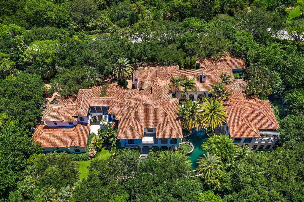 This sprawling Mediterranean Estate sits on 1.25 acres in the heart of The Bear's Club - an ultra exclusive enclave with only 48 estate homes on 369 acres in a park like setting.  Renovated in 2019, this home includes amazing amenities like his/her offices; theatre; resort-style pool with grotto; putting green; and 9 garage spaces.   Just minutes from the best shopping and dining in Jupiter or the PGA corridor, it's also less than a mile from the Atlantic Ocean.
