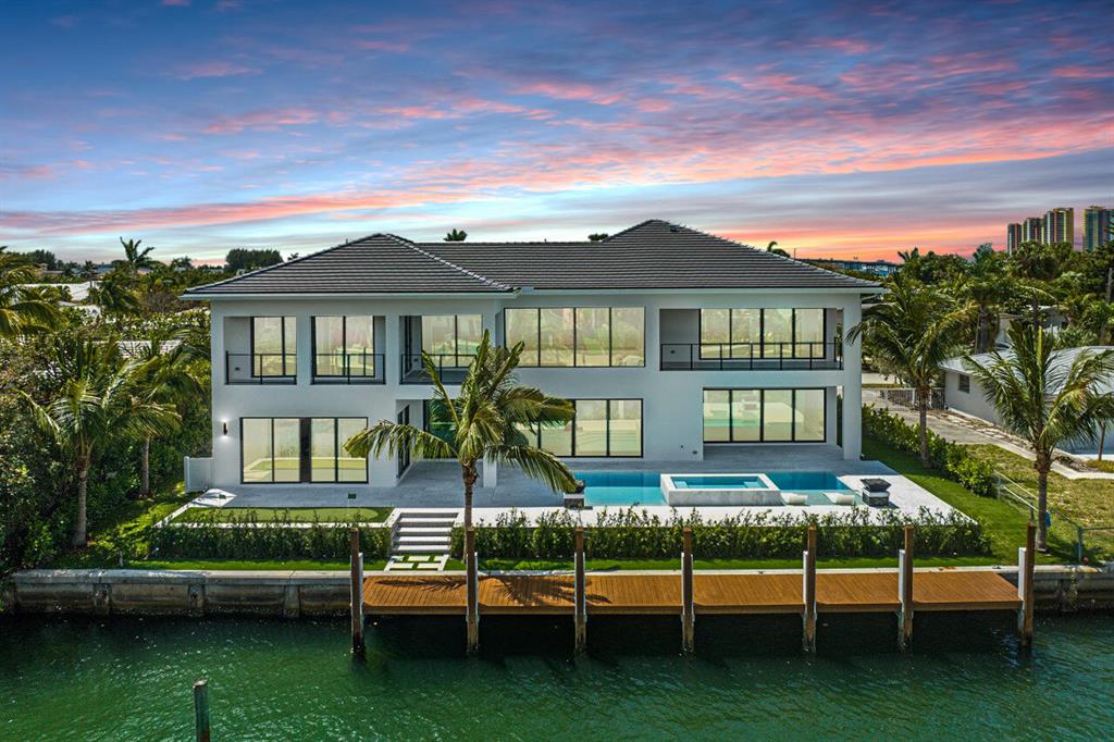 Welcome to a boaters dream waterfront home, steps from the beach! This newly constructed masterpiece boasts 4 spacious bedrooms, including 2 luxurious master suites - one on the first floor and one on the second floor - perfect for hosting guests.As you enter the home, you'll immediately notice the attention to detail and modern finishes throughout. The open concept living area is perfect for entertaining, with a gourmet kitchen featuring top-of-the-line appliances and a large island that overlooks the dining and living rooms.Step outside and soak up the Florida sun in your very own saltwater pool and Jacuzzi, perfect for relaxing after a long day or hosting summer gatherings. With 100 feet of waterfront you can dock your boat in your backyard and enjoy easy access to the Ocean.