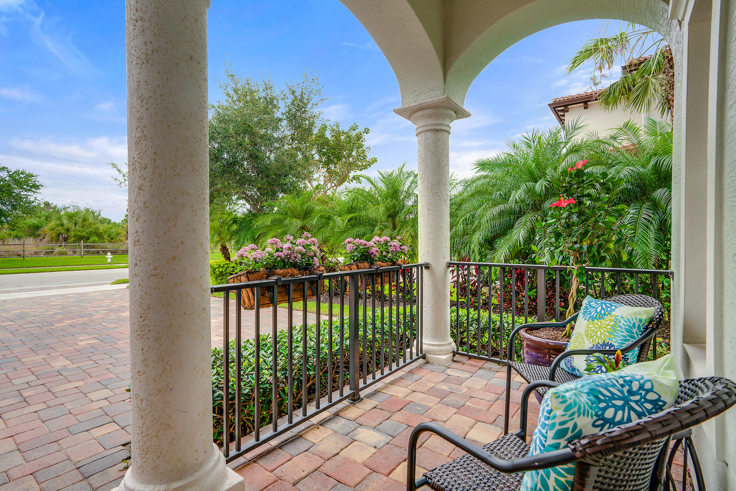 Stunning San Marco model situated on a quiet and private location within the prestigious gated community of Rialto. Crab Cay Way features preserve in the front and extra wide panoramic lake views in back. Walk inside to soaring volume ceilings, extra thick crown molding and bright open space. The living and dining room are complimented with a homework nook and tile flooring on the diagonal through the living areas. The kitchen is open to the great room and features dark espresso cabinets and Blanco Romano granite with tile backsplash. Plantation shutters accent the window openings. Faux finished garage and front doors. One bedroom down with a full bath which serves as a cabana bath as well.
Master Suite and 3 additional bedrooms upstairs.

The luxurious master suite features double doors, custom moldings, dual walk in closets, and a spacious master bath. Quality lighting, fans and finishes throughout the home and pride of ownership shows. Relax in the tropical oasis of your backyard with a south exposure. Enjoy expansive lake views while sitting on your spacious covered lanai. Pool features a travertine marble deck and water features including deck jets. Custom landscaping with accent lighting and fully fenced backyard. The HOA takes care of the lawn in front and back as part of dues.

Rialto is a gated community located in the heart of Jupiter with loads of amenities. Amenities include an amazing clubhouse with fitness center, kids splash park, resort style pool and jacuzzi, numerous playgrounds, basketball, 2 tennis courts, walking/jogging trails and much more. The Rialto social committee is always busy planning events for the residents to come together for people of all ages. Jupiter Community Park is right across the street and is home to many sports for kids and adults. Rialto is centrally located in Jupiter close to beaches, restaurants, and shopping. Only a short drive to Palm Beach International Airport and easy highway access with I-95 and the Turnpike only minutes away.