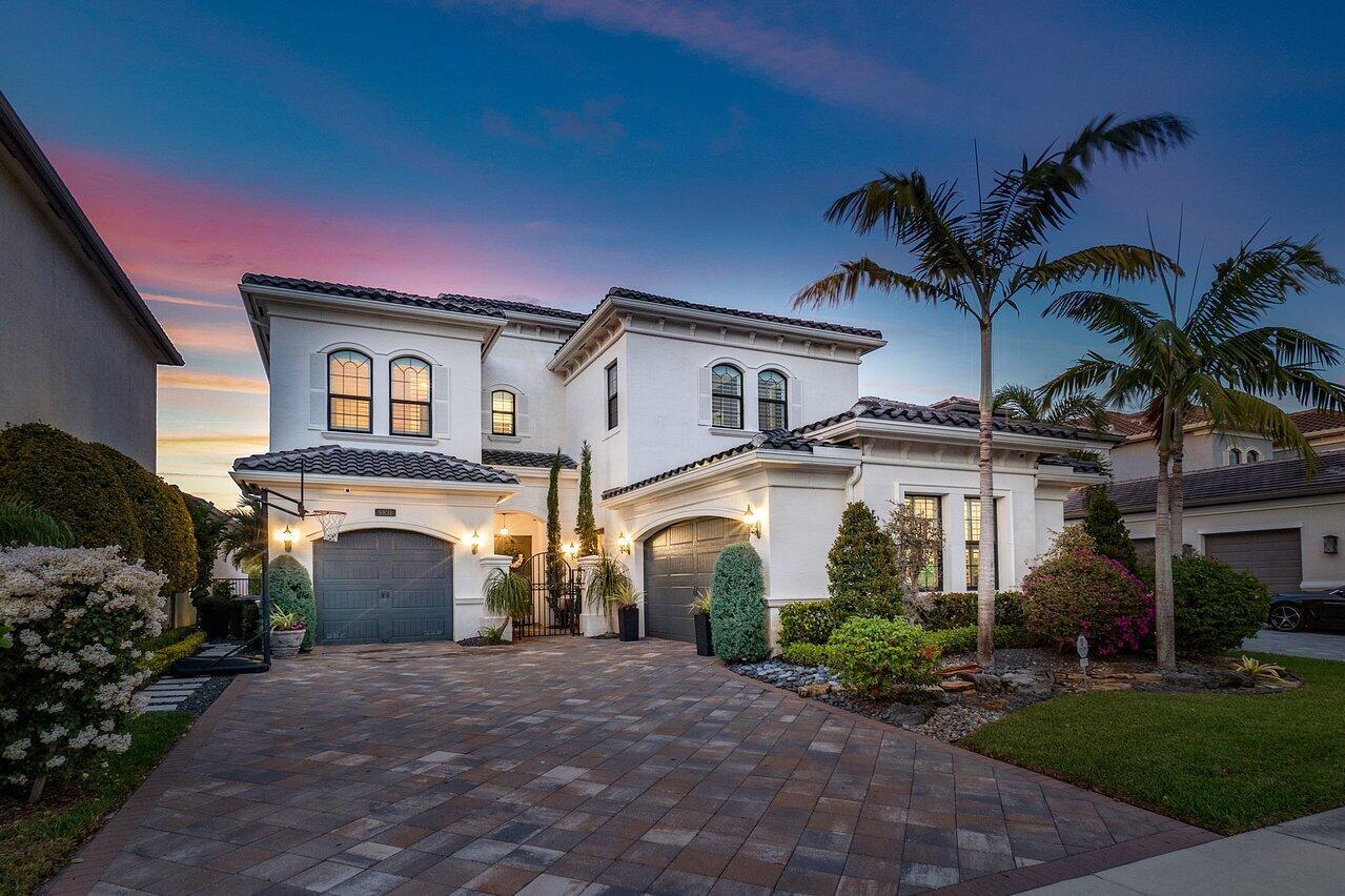 Nestled in a cul-de-sac in the ultimate luxury community of Seven Bridges in Delray Beach, 9831 Vitrail Lane offers a spacious setting to make memories that will last forever with your family and loved ones. Built in 2016, this stunning 5 bedroom, 7.5 bathroom home stretches over 5,233 interior square feet and comes equipped with all of the modern features necessary to live to the fullest. Going up the immaculately landscaped Chicago brick driveway, you'll make your way through a wrought iron gate protecting a covered courtyard entrance. Double doors open into a grand two story foyer where you will find custom light fixtures, wainscoted walls, a wet bar, crown moldings, and hickory wood features that elevate the already majestic space to new heights. Past the foyer, you'll find the open living room, formal dining room, and upgraded gourmet kitchen that are graciously lit by natural light that shines through many impact glass doors and windows. Complete with 42' stacked cabinets, upper and lower cabinet lighting, center island, quartz counter tops, glass tile backsplash, stainless steel appliances, double oven, pantry, and snack bar, this kitchen is truly a chef's dream!

Through the sliding glass doors and into the backyard, the home's patio offers stunning lake views, a sizable seating area with gas hookups for a potential summer kitchen, and a plunge pool and spa.

Upstairs, you'll find the home's bedrooms, with each offering its own en-suite bathroom. The master suite provides the ultimate luxury with coffered ceilings, a seating area, his-and-hers walk-in closets, dual sinks, a roman tub, and a walk-in shower. 

Other luxurious amenities of this home include a 3-car garage, club room, full home sound system, full home camera security system, and mudroom. The home includes 24"x24" polished tile and wooden flooring throughout. 

Seven bridges is a luxury gated community in Delray Beach with over 700 homes. Featuring a 30,000 squarefoot clubhouse, resort-style swimming pool, 6 har-tru tennis courts, pickleball, a fitness center, yoga studio, and more, this luxuriously landscaped community provides the ultimate security with a 24/7 staffed guardhouse. 

Don't let this opportunity slip away!