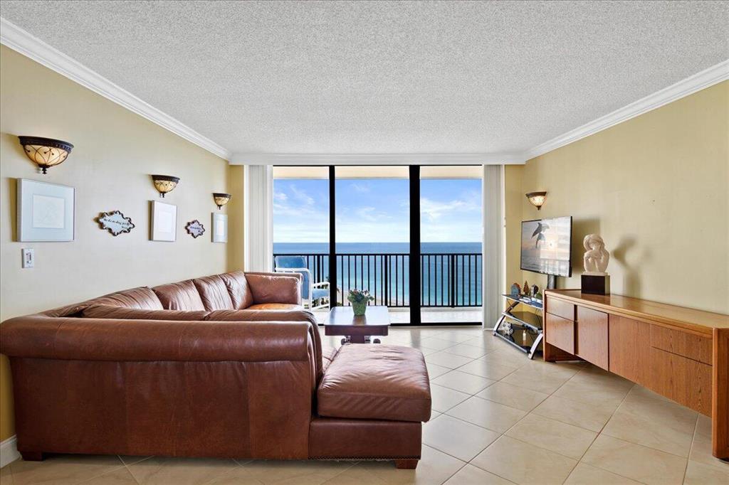 Breathtaking ocean views abound in this 2bd/2ba 10th-story unit.  One of the BEST VALUES in the 300 Building with a manager onsite! Relax on your spacious covered balcony with views of the Jupiter Inlet! Newer kitchen with upgraded cabinets, granite countertops and appliances, remodeled master shower, and newer guest bath. Newly tiled floor in the guest bedroom. Washer and dryer inside unit. Covered assigned parking space and storage unit. Ocean Trail is within walking distance of Ocean Dunes public golf, The Maltz Theatre, Mini golf, numerous waterfront restaurants, and Dubois Park. Amenities galore with several pools, a hot spa, numerous tennis courts, and a walking trail.