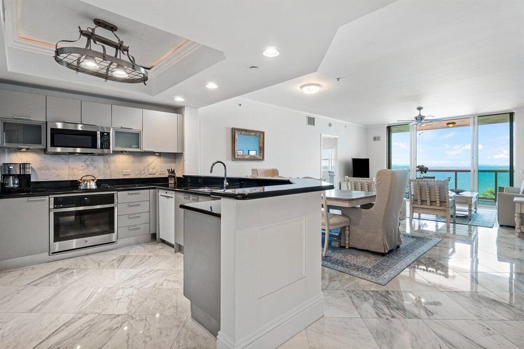 Immaculate 7th floor unit! Seller will pay special assessment! Offered Fully Furnished! Gorgeous Intracoastal views, 2BR/2.5BA, 2020 A/C, diagonal tile floors, crown molding, impact glass, fob elevator access. Split floor plan, spacious primary suite w/his/her walk-in closets. Primary bath w/jetted bath & water closet. Assigned parking in covered parking garage, climate-controlled storage unit. 24/7 manned gate, valet, tennis, pickleball, walking path w/gazebo, covered rooftop oasis w/pool, spa, BBQ areas, clubhouse, billiard room & fitness center. Adjacent marina w/dry docks available. Minutes to the ocean by boat; no fixed bridges! Pet friendly. Minutes to nationally ranked Blue Heron Bridge snorkeling/diving. 2022 waterproofing project , management can give details