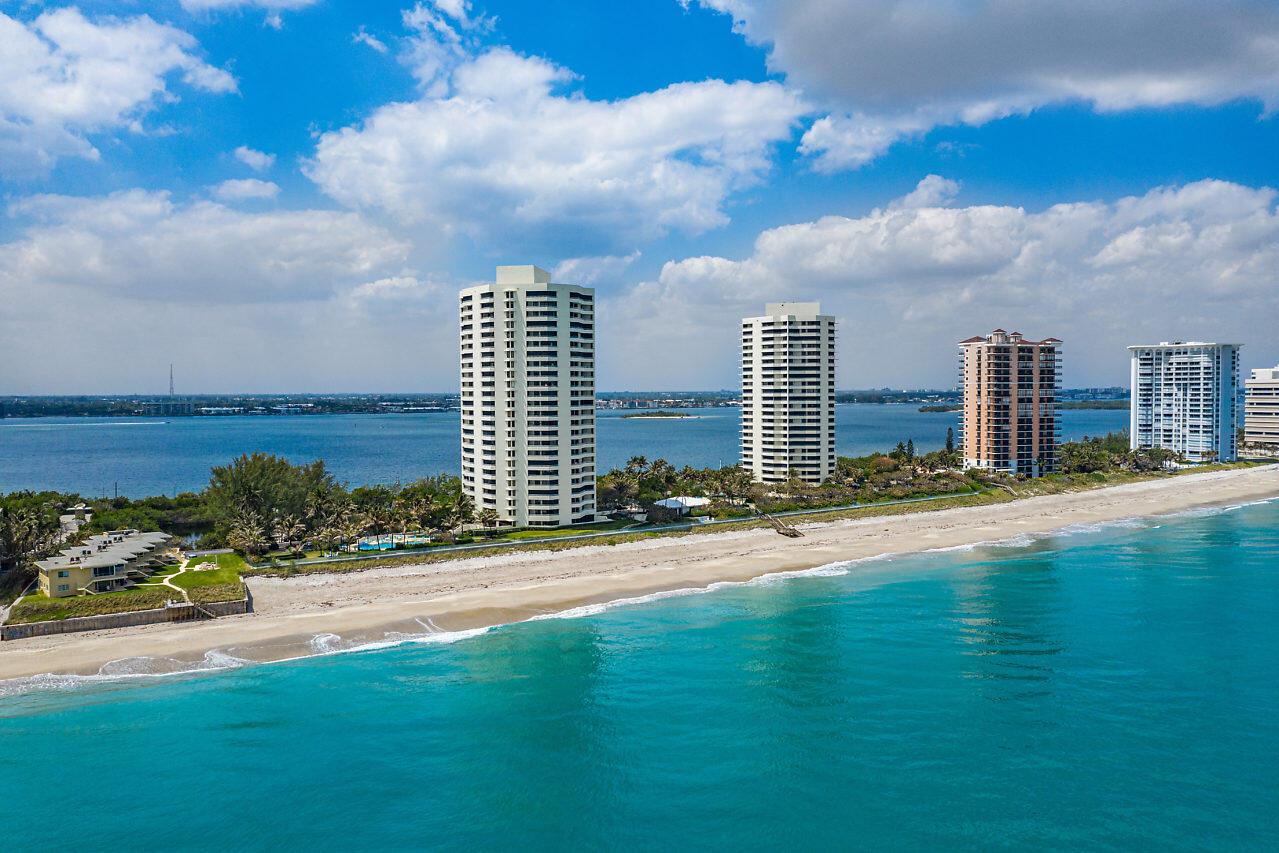Furnished spacious 2/2 condo with expansive intracoastal views from every room and ocean views too. Updated kitchen countertops and backsplash.  Beautiful living room built-in with floating shelves. Full laundry room with utility sink. TWO garage parking spaces. BRAND NEW A/C. Water filter. Just steps to the beach, plus 2 pools, 2 hot tubs, fitness center overlooking ocean, sauna, shuffle board, tennis, pickleball, billiards, gas grills, fenced dog park. 14 Acres with 900' walkway along seawall with glass railing. Ample guest parking and electric car charging stations. See sunrises at the beach and sunsets from your balcony. Close to airport, shopping, dining, golf, and much more.