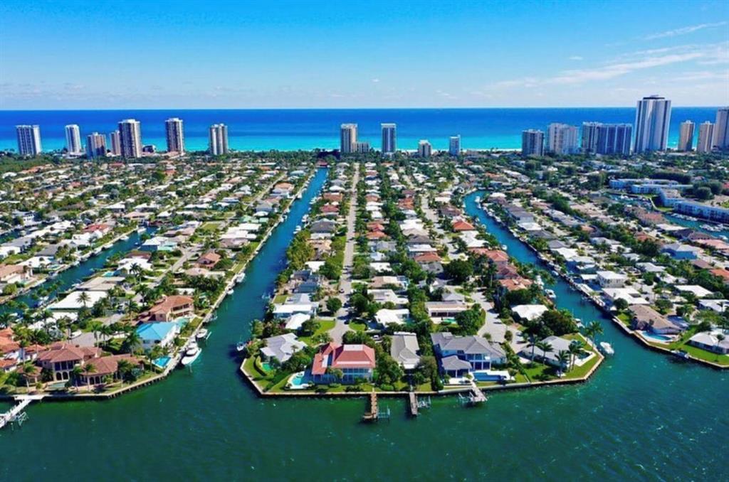 This extra-large lot (15,150 sqft) has deep water dockage and 75' of waterfrontage. The property offers southern exposure and is minutes from the Lake Worth Inlet and Peanut Island, with no fixed bridges to get to the ocean. The dock can accommodate up to 55' boat or multiple boat lifts. Only a short walk to the beautiful Singer Island beaches. This price reflects lot value only. See video for walk-through. Gutted shell and functional boat lift on property.Available separately: A sealed set of plans for a two-story 4,950 sqft custom home with 1,970 sqft garage and pool. MORE ->>>>>> Marine permits authorize the following: 1) Remove an existing dock, floating platform, and boatlift and install a 203 sqft dock and new boatlift 2) Install 74 linear feet of seawall within 18 inches (wetface to wetface) of an existing wall; and 3) Construct 74 linear feet of seawall cap along an existing seawall.

All measurements approximate. Refer to plans.