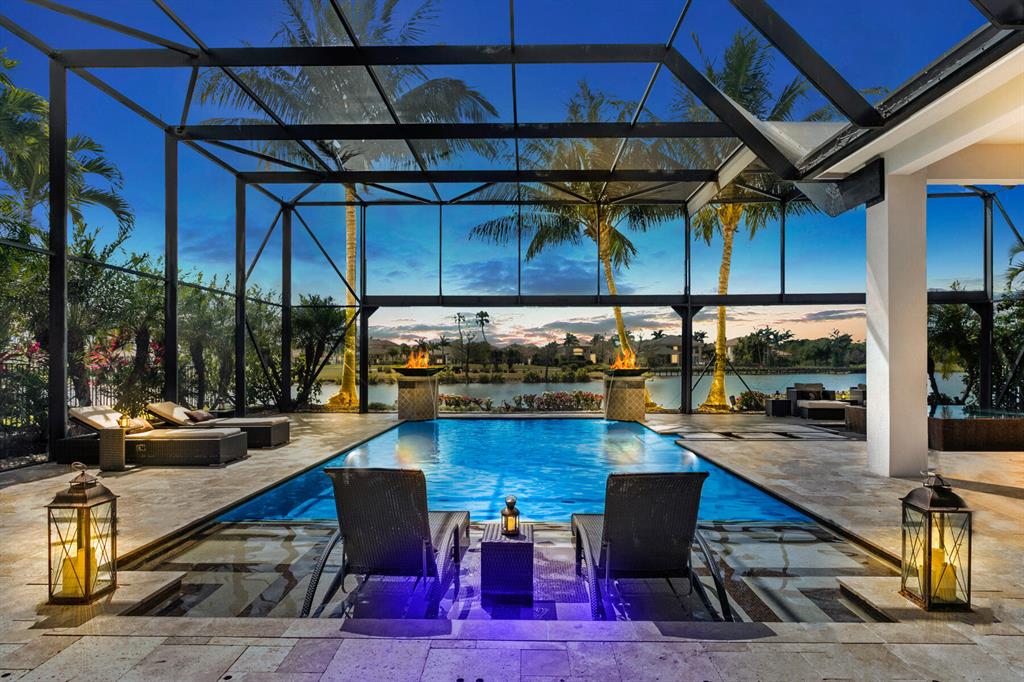 THIS MODEL HOME HAS IT ALL! FULL GOLF MEMBERSHIP AVAILABLE NOW or sports/social.  Finest architectural upgrades and quality craftsmanship. Prime Cul de Sac location! Stunning 4BR/4.5BA estate home w/rarely available southern expansive lake, golf, and preserve views in the world class Jupiter Country Club. Newly renovated state of the art kitchen w/large island, stainless steel Wolf appliances, gas burners, Subzero refrigerator. Walls of glass impact retractable sliders open to outdoor oasis w/hurricane proof screened lanai w/travertine patio perfect for entertaining. Resort style heated salt water pool w/sundeck, spa,fire bowls/fountains, outdoor shower, lounge areas w/televisions,surround sound,and commercial grade landscape lighting. Chefs summer kitchen w/Alfresco grill that seats 7 gas range, freezer drawers, warming drawer, condiment station.
Additional features volume ceiling w/crown molding , marble and hardwood floors, custom built ins, security system w/cameras, wet bar w/wine cooler. Manned gate, luxury amenities, Greg Norman golf. Minutes from A-rated schools, beaches, shopping, dining and cultural venues.