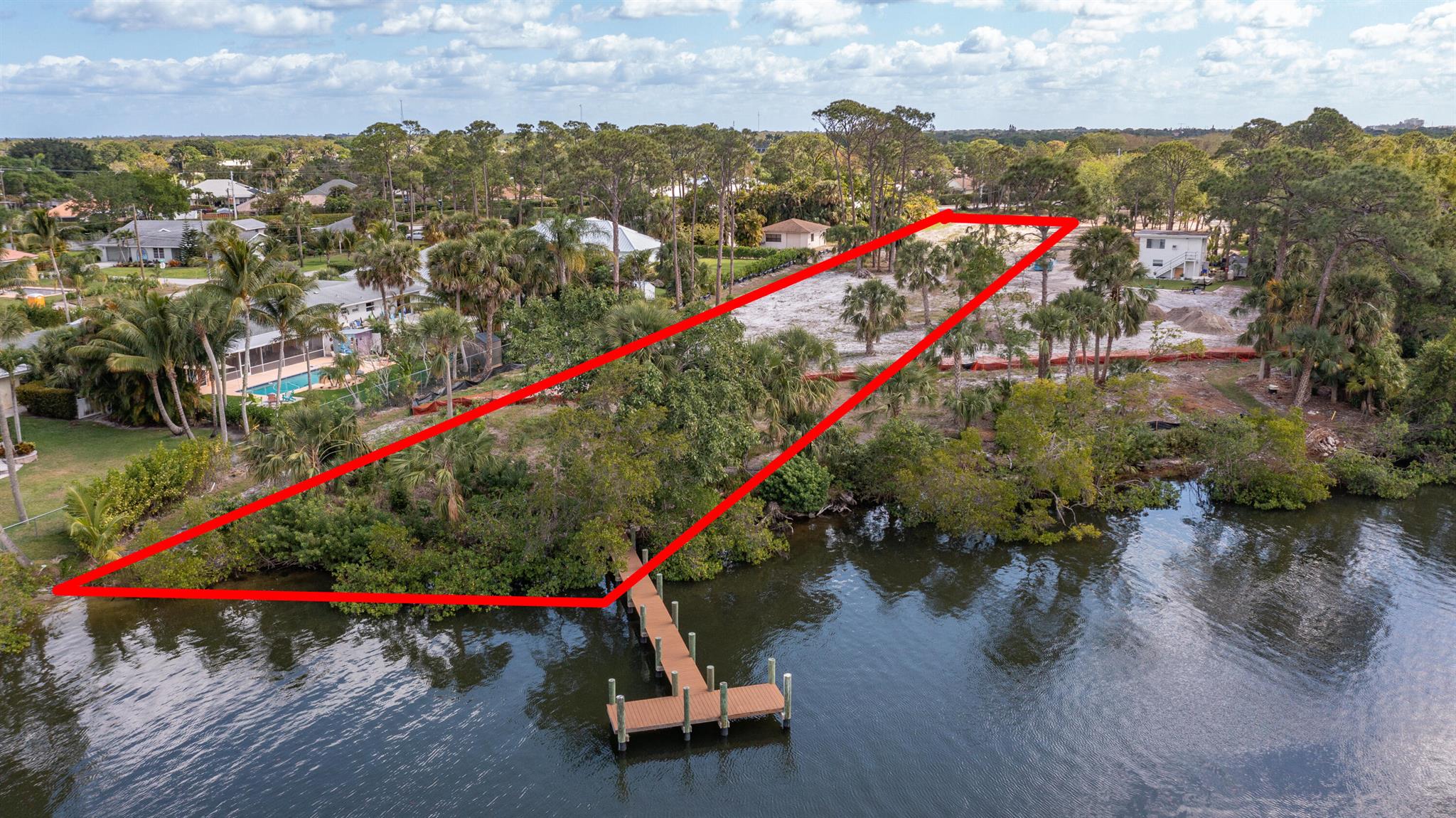 Simply AMAZING riverfront estate lot boasting almost 2 acres (1.95) and 145 feet of waterfrontage. New dock in place and the lot has been entirely cleared. Survey, environmental reports, tortoise survey, PAMP are already completed and available to a new owner.  You are READY TO BUILD a peaceful estate offering privacy and spectacular views on one of the largest lots on the Loxahatchee river.  Minutes to the inlet and NO fixed bridges.  Jupiter's reputation is second to NONE offering the finest properties and amenities.  Restaurants, shopping, beaches, the best golf courses, boating and fishing are only a very short list of what Jupiter has to offer.  Also within minutes to PBI.Come build your estate.  By appointment only.  No trespassing !