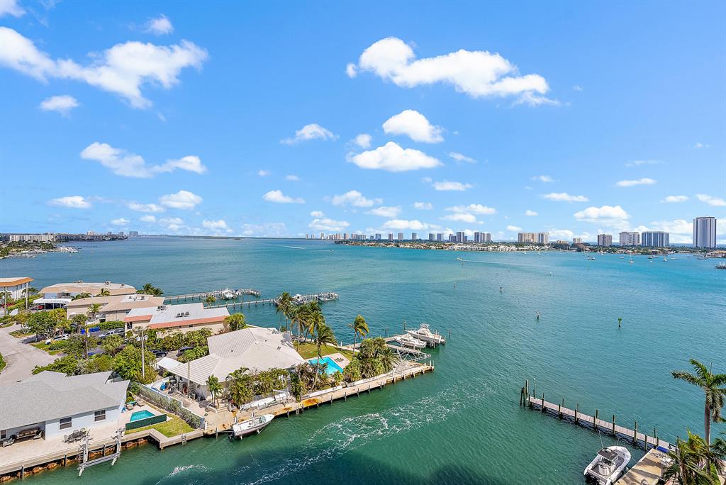 Intracoastal view, 2BR/2.5BA,  laminate floors, crown molding, impact glass, fob elevator access. Split floor plan,  primary suite w/his/her walk-in closets. Primary bath w/jetted tub & separate shower. second bedroom w/walk-in closet and bathroom. Assigned parking in covered parking garage. 24/7 manned gate, valet, tennis, pickleball, walking path w/gazebo, covered rooftop oasis w/pool, spa, BBQ areas, clubhouse, billiard room & fitness center. Adjacent marina w/dry docks available. Minutes to the ocean by boat; no fixed bridges! Pet friendly. Short drive to the beach. 2022 waterproofing project , management can give details