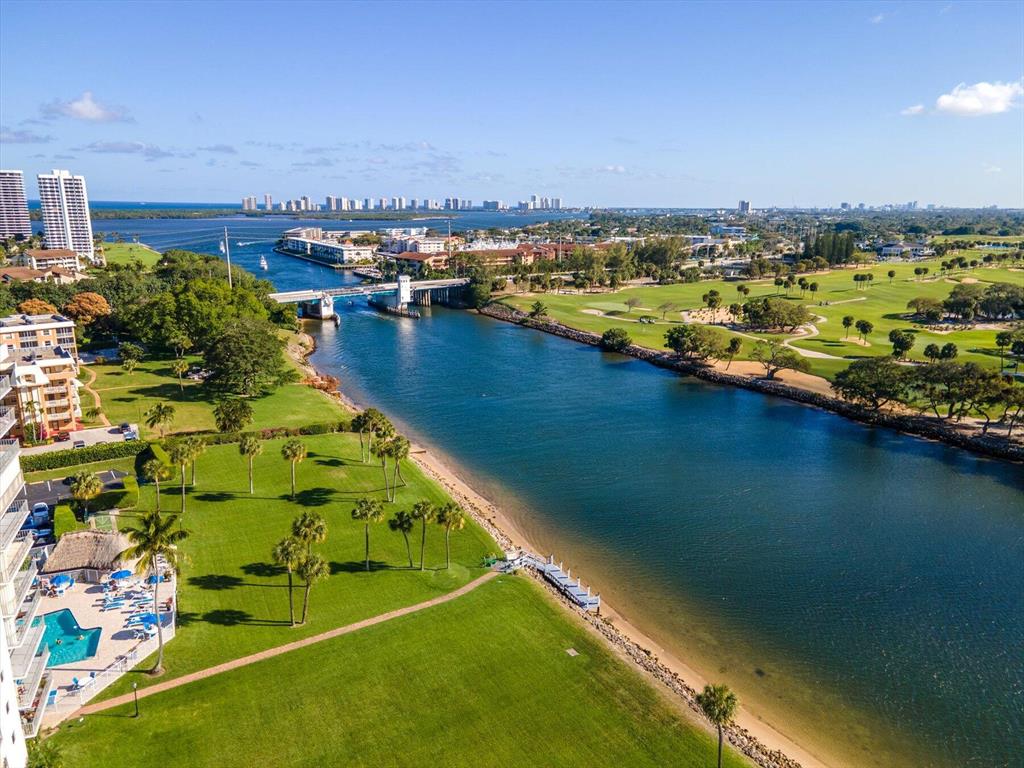 Wonderful views of intracoastal & golf course from 4th floor balcony-Split 2bed/2bath well kept Condo- 2nd Bed used as office-with built-in desk & Murphy Bed--Washer/dryer, laminate wood floors through-out-Nice Kitchen cabinets/SS & updated vanities in baths. Secure building-has gated parking, front desk, pool, gym, tiki hut, card/pool & clubroom, kayak & bike room- Best Location-Walk to shops, restaurants & stores. Bike to Juno Beach or 10 min car ride to Singer Island Beaches-Walk to Public NPB Golf Course & North Palm Beach residents you'll have access to Tennis Club & Olympic Size Pool Club-West Palm Beach Int. airport-Palm Beach Island-WPB-are all a 20 min drive-Building is all done/50yr insp. includes all required increases-Ins. & Reserves-HOA includes EVERYTHING except Electric