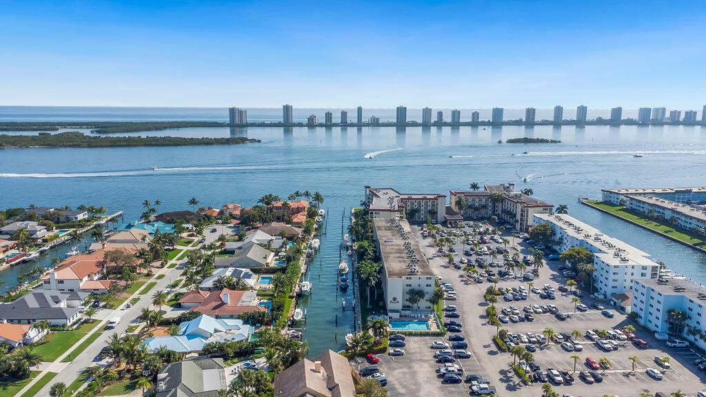 This pristine ALL AGES 1 bed/1 bath condo boasts breathtaking views of the Intracoastal from its prime location. The bathroom has been newly renovated with high-end fixtures & finishes, providing a luxurious spa-like feel. A comfortable & inviting living room features plush seating & large windows that flood the space with natural light. A huge bedroom w/dual closets provides abundant storage. Your private balcony overlooking the Intracoastal is an ideal spot to enjoy the beautiful sunsets or watch boats passing by. Amenities include a community pool, grill, outdoor dining, kayak storage & on-site laundry facilities ensuring that residents have everything they need to be comfortable. Here, luxury meets convenience, making it an ideal home for those seeking a sophisticated coastal lifestyle