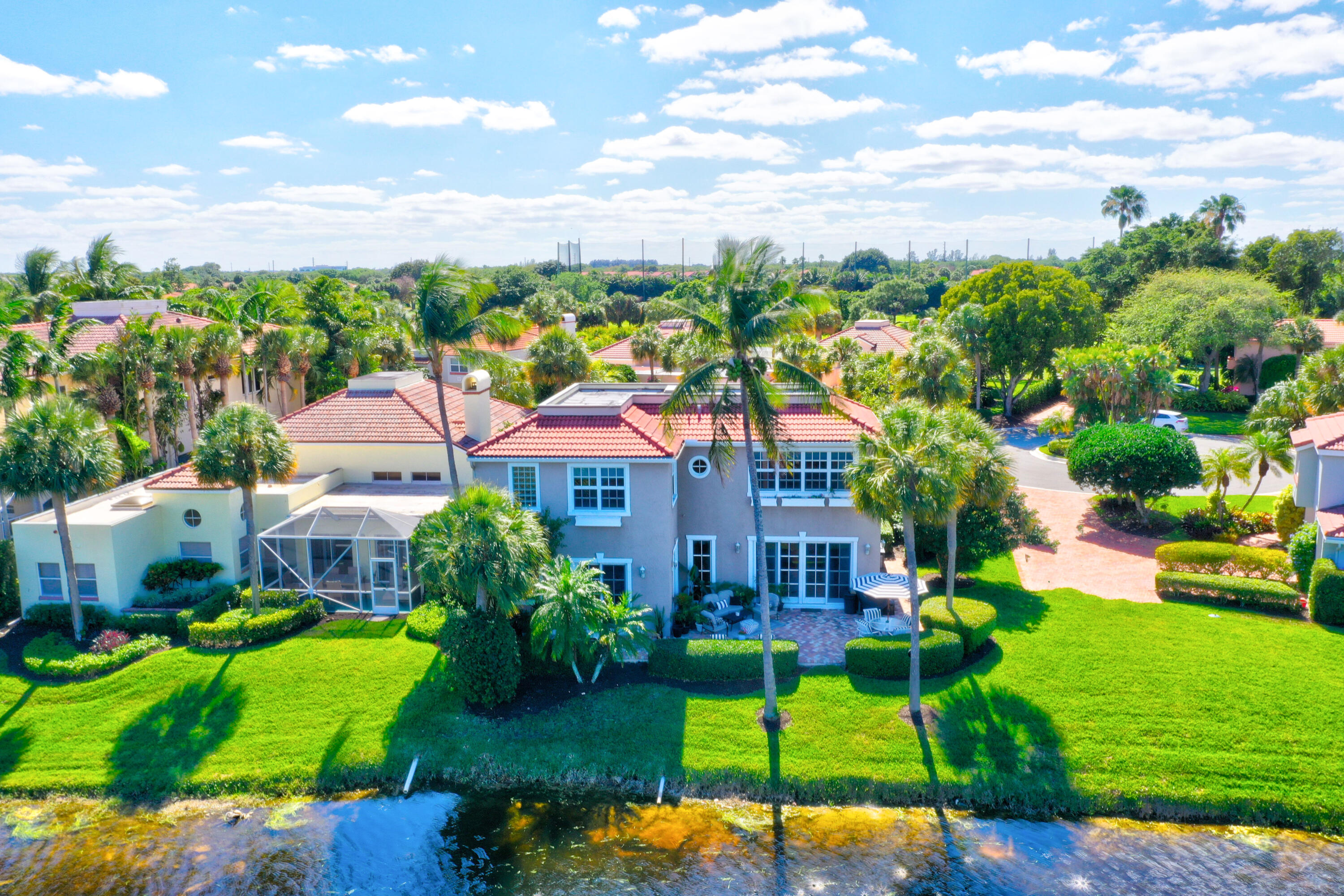 If you are seeking a breathtaking serene setting this stunning updated and expanded home has water views everywhere. Large open spaces plus both an office and a den create an ideal Floorplan for both entertaining or quietly reading a book or watching tv. A gourmet center island kitchen with custom wood and glass cabinets, granite countertops, a Sub-Zero refrigerator, two Miele dishwashers, two wine coolers, an insta-hot faucet, a built-in warming drawer and a walk-in pantry should make every cook happy.  The neighborhood community pool is just down the street. Jonathan's Landing is a sought after gated golf community where membership is not Mandatory. Close to the Beach, Restaurants, Shopping and West Palm Airport. Come see in person!