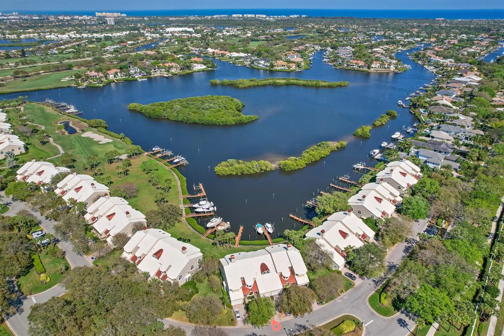 Special top floor 4 bedroom 4 bath Harbor Home. Property includes Rare Social Membership which can be upgraded to sports or golf. Wake up to a sunrise overlooking spectacular long water views.   Remodeled open kitchen/family room design and enclosed lanai open to the living area.  Its large floor plan has plenty of room for visiting guests.  3 bedrooms are ensuite. Just steps to your private dock for up to a 34' boat with direct access to the ocean with no fixed bridges. In addition, the unit provides full impact resistant windows and sliders plus a 1.5 car garage.  Club amenities include: 45 holes of golf, world class spa and fitness center, 2 club houses, tennis, pickleball, and several dining options. Fun in the sun awaits you at Admirals Cove, one of the top private clubs in America Larger boats can be accommodated at our 63 slip deep water marina.  Admirals Cove has just built a state of the art 4800sf golf performance center to really tune up your game.  For smaller children "The Covesters" the club provides supervised activities. 

Other features include: plantation shutters, recently installed HVAC and water heater, smaller neighborhood pool across the street.  Floor plan to be included April 5th.