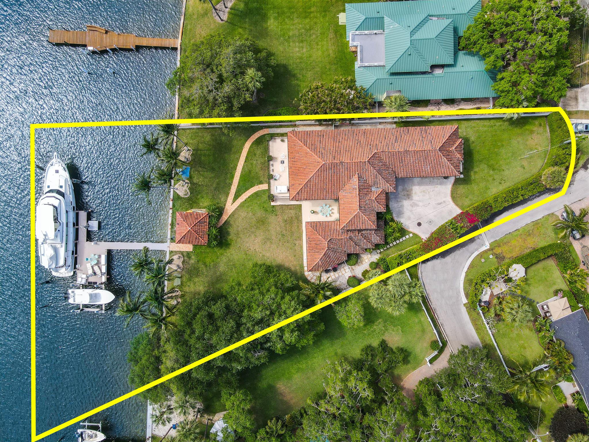 Direct Intracoastal Estate Home with expansive water views in the heart of Palm Beach Gardens. This unique property is situated on 1.4 acres of land in a no wake zone, boasts 160 ft of water frontage and can accommodate a large vessel, such as an 80-100ft yacht with no fixed bridges. Exquisite details and upgrades include: impact windows & doors, Chef's kitchen w/ top of the line appliances, granite countertops, saturnia floors, generous size bedrooms, custom closets, an upstairs loft/gym area, den, and 4 car garage. Sunlight from the east  illuminates the living and gathering spaces. Exterior of home is elegantly landscaped with plenty of covered and open air entertaining spaces. Close proximity to restaurants,shopping,beaches,highly desirable schools & I-95. A True Boater's Dream!