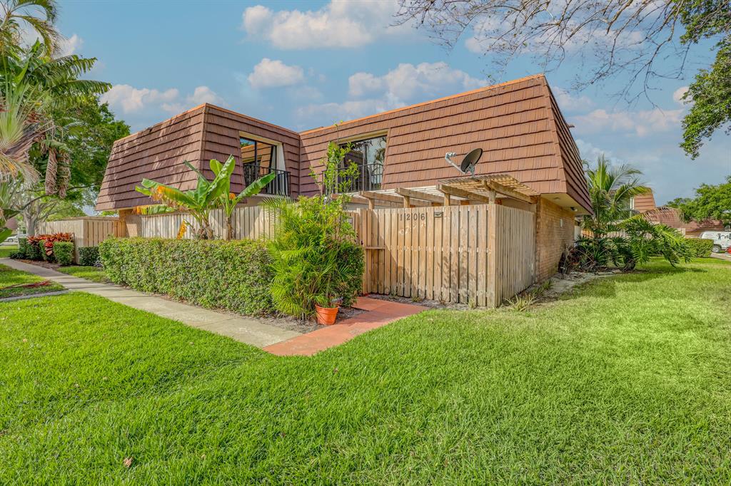 Welcome to this well-maintained Divosta Quad in sought-after Garden Lakes. 2 brdm, 2.5 bath with den (size of a bdrm) and fireplace. Tile and laminate flooring throughout. Master Bedroom has two over-sized walk-in closets. Front load washer/dryer. The fenced private courtyard provides great afternoon shade with Eastern Exposure, and has large storage shed. AC Unit is in quiet, peaceful location of Garden Lakes which is centrally located in the heart of Palm Beach Gardens. Community offers tennis, racquetball, Basketball, Fitness Trail, Tot Lot, and beautiful manicured landscaping. Walk to top notch restaurants, Publix, and Starbucks...short drive to Gardens Mall, easy access to both T-pike and I-95. Parking space in front of unit, and plenty of guest parking. Priced to sell, with opportunity to renovate to your liking.