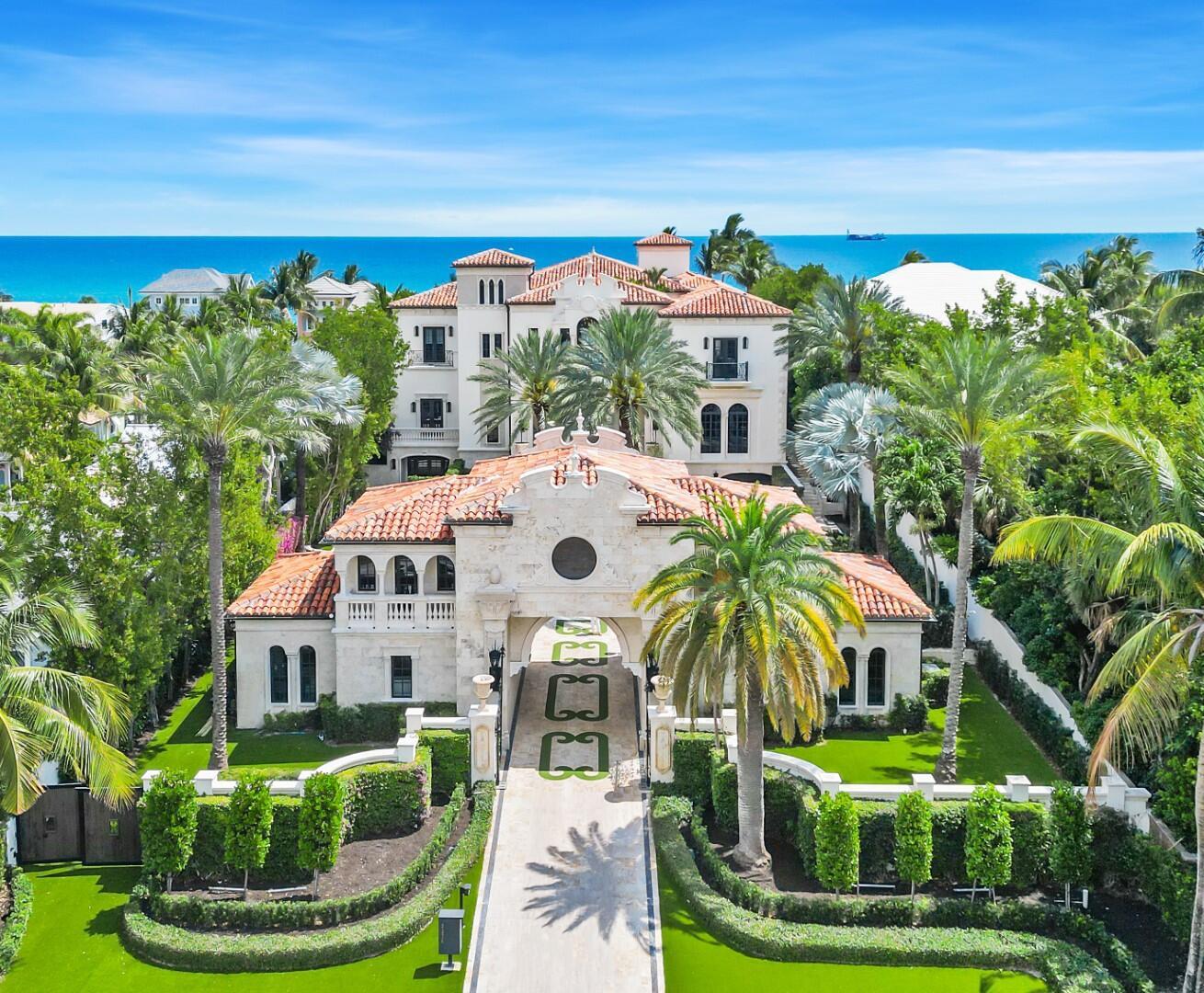 Spectacular direct Oceanfront 9BR/13.7BA Estate, custom built with commanding, unobstructed ocean views. Gorgeous detailing throughout this palazzo-inspired compound- custom finishes, intricate marblework, and beautiful artisan millwork. Fantastic outdoor spaces including fountains, balconies, oceanfront pool and spa, and covered loggia with summer kitchen. Interior highlights include grand foyer with imperial staircase, formal living room with detailed fireplace, screening room, gym, game room, and stunning formal dining room. Oversized club room with custom built-in bookshelves, marble fireplace, and bar, perfect for hosting. Sweeping southeast ocean views from the spacious Owner's Suite. Gourmet chef's kitchen opens to breakfast nook and oceanfront family room. Beautiful carriage house
