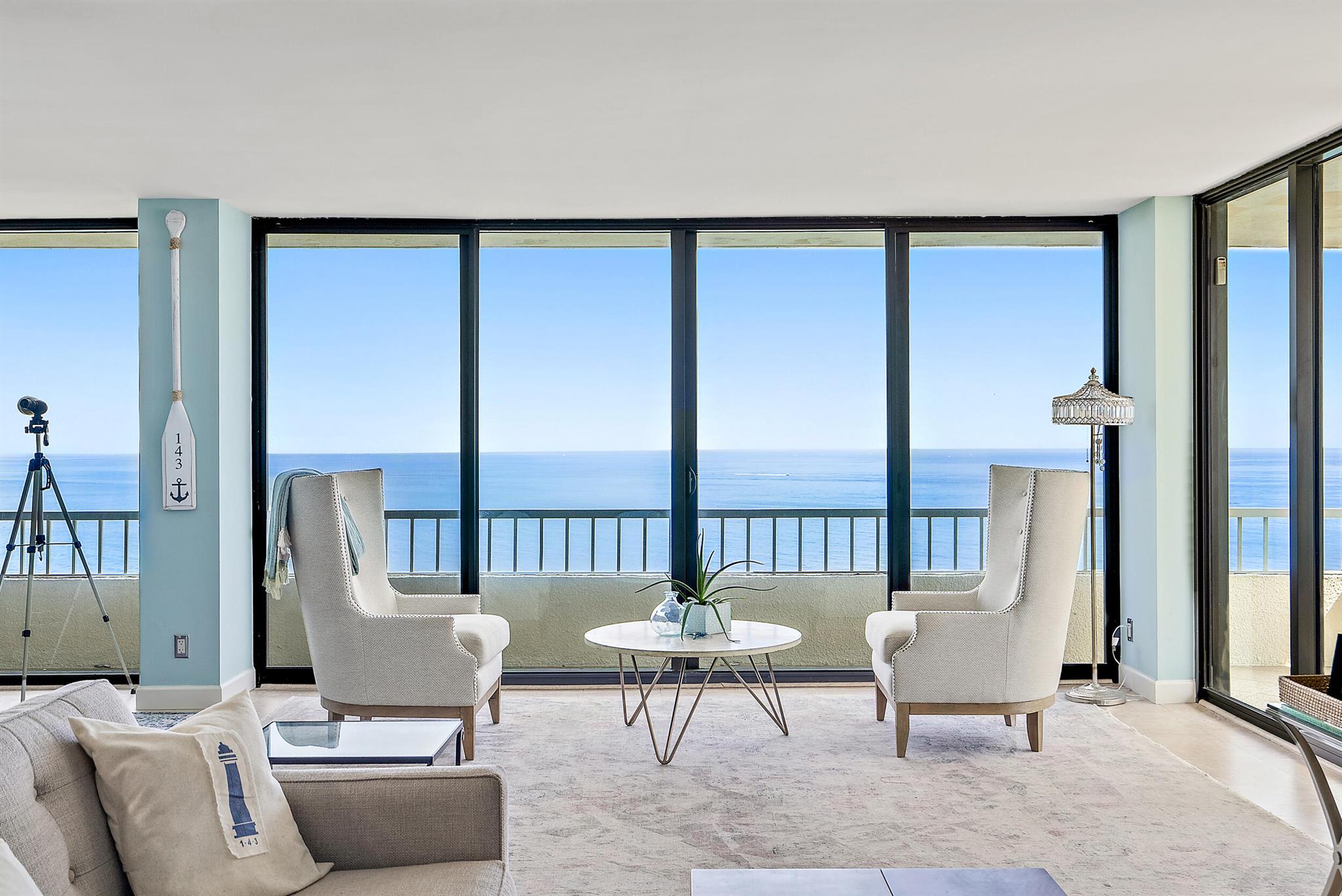 Direct Ocean Front condo with unobstructed panoramic views surrounded by gorgeous blue & turquoise waters overlooking the Ocean to the east and John MacArthur Park just north with incredible water Views from every room! This direct east/southeast residence has floor to ceiling impact glass windows and doors, renovated open kitchen with additional features including hardwood floors in bedrooms and tile throughout the main living areas, master-bath has dual vanities, separate bath and walk-in shower. Relax watching the boats cruise by while enjoying dining & drinks on your balcony with wide open views everywhere! This property boasts some of the best views on Singer Island! Water Glades residents have access to many amenities including private beach frontage... See Supplement... two heated pools, tennis courts, lush landscaped recreation deck with an oceanfront owner's lounge with gorgeous views and plenty of space for entertaining. Each building has its own exercise room, library and extra storage. Water Glades is a 24-hour manned gated community just adjacent to MacArthur Beach State Park and nature preserve.