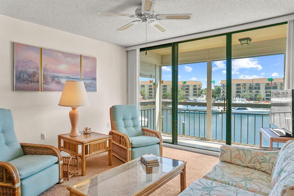 Enjoy spectacular views & tropical breezes while overlooking the beautiful Marina from the living room, kitchen, master bedroom and balconies. Large Living Area, Dining Area, Breakfast Bar, Large Bonus/Laundry Room-Great for Storage-Office or Overnight Guest. The Four Pool areas have covered Pavilions and water views. Enjoy a game of tennis, day or night on the resurfaced courts. Lush tropical landscaping professionally maintained throughout the community. Winding sidewalks are great for walking or a safe off-street bike ride with beautiful Water Vistas. The Bluffs has sidewalks up to the beaches. No shortage of options for fine dining, theaters, & nightlife. It's just minutes to Jupiter Beaches, Juno Pier, Jupiter Harborside and the Jupiter Inlet.