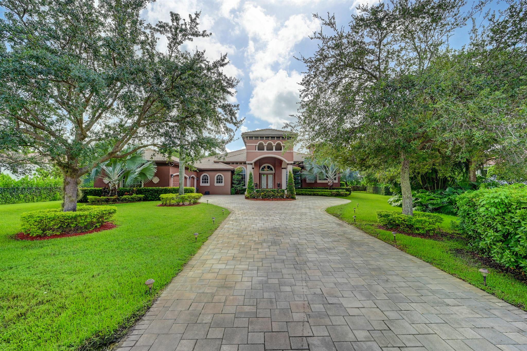 Owner financing up to $500,000 available on this HUGE ESTATE POOL HOME in gated community with a 3-car garage. There are 7 rooms (5 BR, 1 Office with built in bookshelf, 1 Media Rm (currently used as a 6th bedroom with private living room), plus Master has 2nd office overlooking pool area) plus 5 1/2 baths. The free form pool in a fenced back yard has a paver patio that feeds into 2 covered outdoor living spaces. The interior boasts plenty of natural light, a grand entry, 16ft volume ceilings with crown moldings, 21ft dining rm, an open concept Tri-Split floor plan (3 wings each with their own A/C units) & oversized bedrooms with on-suites.  New water heater 2020, pool and sprinkler pumps upgraded 2022-2023. All Appliances are fully functional and are covered by a home warranty company.