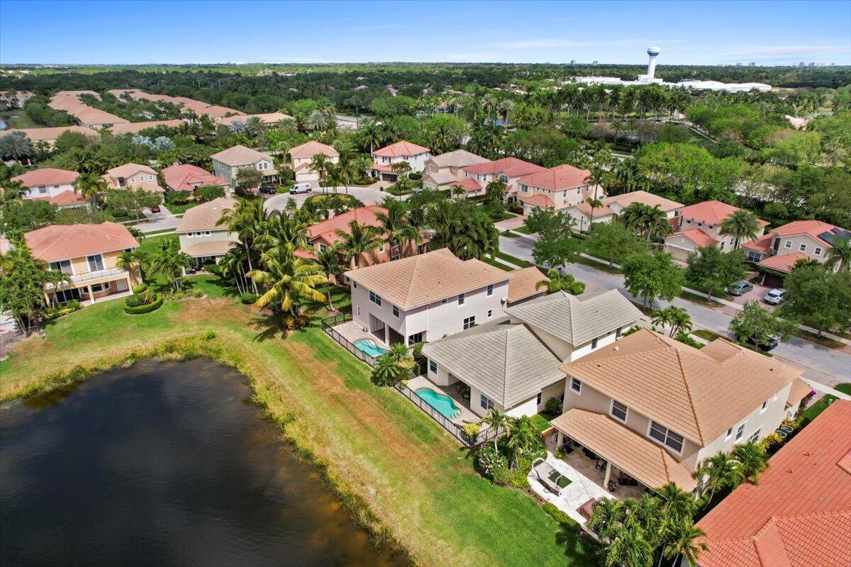 ''Fabulous Sunset Lake Views'' 4 Bed/3 Bath Pool Home with Master Bed & 4th Bed/Guest Suite Downstairs. Etched Glass Foyer Entry. Open Kitchen Includes; Top-Notch Stainless-Steel Appliances, Beveled Granite Countertops, Diagonal Tile Backsplash + Separate Windowed Breakfast Area. Sun-Filled Family Room Leads to a Covered Patio/Lanai that has Gorgeous Pool & Lake Views, Perfect for Entertaining. Large Great Room (Living/Dining Rooms) + Downstairs 4th Bed/Guest Suite. Upstairs 2nd & 3rd Bedrooms + a Large Shared Entertainment Loft. Diagonal Tile Downstairs, Impact Glass Throughout. Pristine Condition. Paloma is a Gated Community with a Community Clubhouse, Fitness Center & Pool, Minutes to the Beach, Tennis Center, Public Golf Courses, Restaurants, Shops & Airport. Triple ''A'' Rated Schools