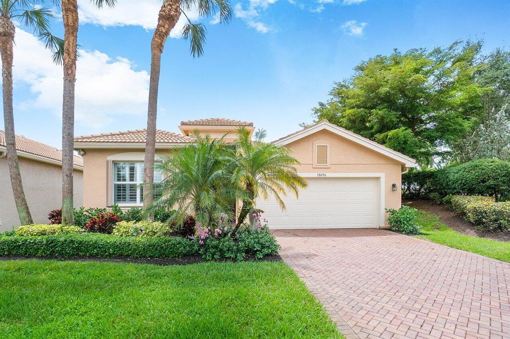 JUST STEPS FROM THE CLUBHOUSE IS THIS MOVE-IN READY, LIGHT FILLED, OPEN FLOOR PLAN, IMMACULATE SOPHIA MODEL HOME IN FAMED VALENCIA RESERVE. SET ON A PREMIER WATER LOT WITH NEW LUSH TROPICAL LANDSCAPING, EXTENDED LANAI, AND PRIVATE YARD. THE A/C IS BRAND NEW AND THE ENTIRE HOUSE WAS JUST PAINTED. THERE ARE UPDATED TILED FLOORS, PLANTATION SHUTTERS AND LED RECESSED LIGHTING THROUGHOUT. BEAUTIFUL GOURMET KITCHEN OFFERS LIGHT CABINETS, GRANITE COUNTER TOPS, TILED BACKSPLASH, & SS APPLIANCES. VR IS AN EXTREMELY ACTIVE AND WELCOMING ADULT COMMUNITY WITH A PLETHORA OF AMENITIES INCLUDING A CAFE, CLUBS, SHOWS, CLASSES, CRAFTS, LECTURES, 9 HAR-TRU TENNIS COURTS, FULL-TIME TENNIS PRO, 4 PICKLE BALL COURTS, BOCCE BALL, GYM, POOLS, A FULL-TIME SOCIAL DIRECTOR, ETC...WELCOME HOME!!!