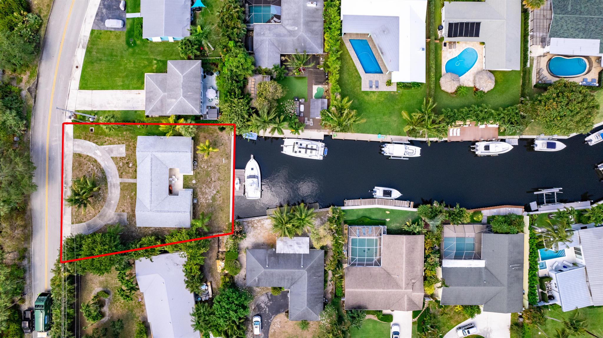 Build your dream waterfront home with intracoastal and ocean access and no fixed bridges. This unique lot looks directly down the canal framed by Palm Trees and boats highlighting it's old Florida charm. 83' of waterfront with private dock that can accommodate boats up to 35'. Paradise Port is a cozy boat-friendly community with no HOA fees! Other features of the property include a well maintained seawall and room for a beautiful circular driveway. AC is not working in Duplex. Minutes to everything Juno Beach, Jupiter and downtown Palm Beach Gardens has to offer. Minutes to 1-95 and 25 minutes from PBI airport - this is the boaters paradise location you've been dreaming of. Walking &/or  distance to the beach, restaurants.