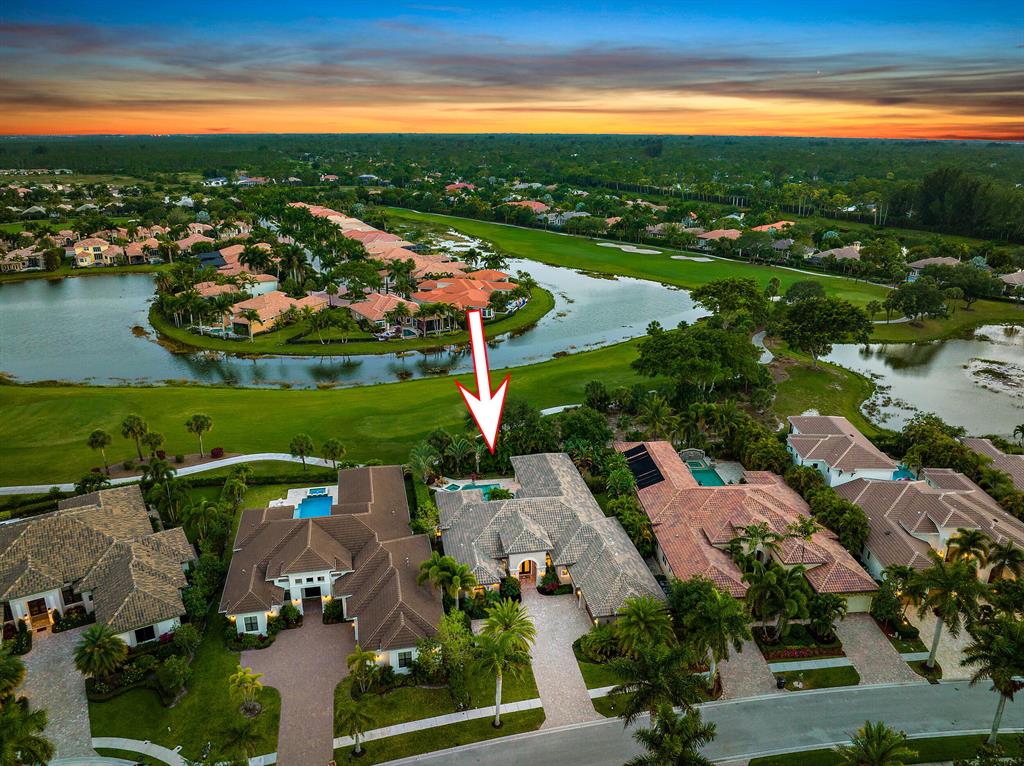 Welcome to one of the most recently built estate homes at the Club at Ibis. This fabulously upgraded, luxuriously appointed, 2016-built, designer-done Dreamstar Custom home is nestled in a private lot in desirable Bent Creek overlooking Tradition #11. A long driveway and lush landscaping greet you and provide wonderful curb appeal. With 4BR/4.5BA+Den, this Dreamstar Custom Home is elegantly proportioned, offering grand spaces while still providing a more intimate feel in all the right places--this home is just the right size. Impressive 36''x36'' marble flooring sets the tone for this contemporary masterpiece. Extensive ceiling treatments, sleek and sophisticated surfaces and generous designer upgrades. Dreamstar worked with a designer on the finishes for this home, and it shows. The gourmet kitchen boasts designer cabinetry with raised wood doors, a Thermadoor appliance suite including a six-burner gas stove with griddle and a pot filler. Striking Taj Mahal granite tops, microwave drawer, wine cooler. Incredible privacy and serenity can be found in the lushly landscaped backyard. The custom pool features a large sun shelf and raised spa, a spacious covered lanai with Cypress tongue and groove ceiling, as well as an outdoor kitchen. Retractable screens make the covered lanai perfect for outdoor entertaining, dining and relaxing. Impact glass throughout. Handsome wood flooring in the office. All bathrooms feature decorator-selected tile combinations. Simply move into this timeless and modern yet warm estate home in one of Ibis's most sought-after neighborhoods. The Club at Ibis is an award-winning community that boasts a 90,000 sq. ft. clubhouse, three 18-hole Nicklaus-family Championship golf courses, five restaurants, a world-class fitness complex and spa, and incredible tennis and pickleball facility.